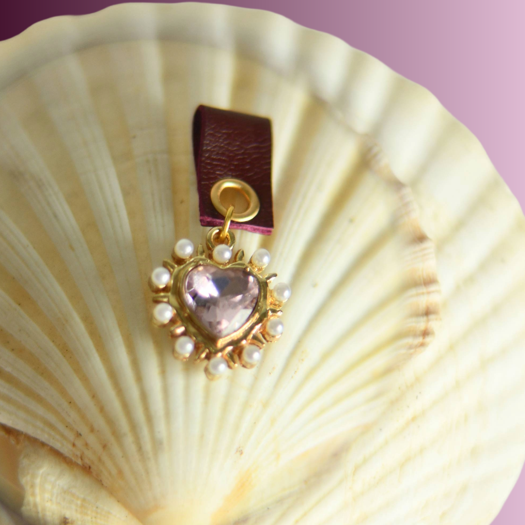 Baby Pink heart with pearls around attached with dark red leather holder