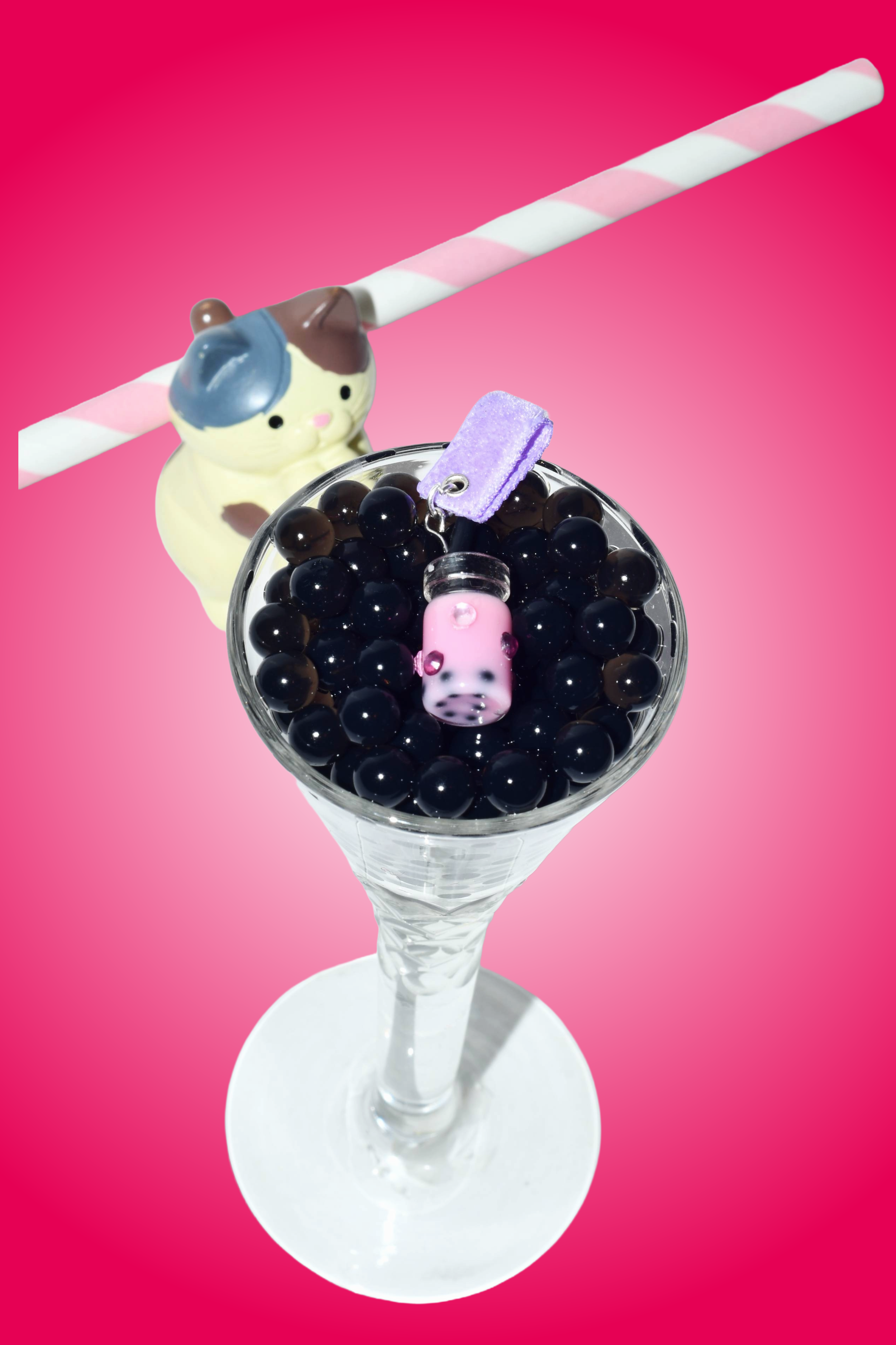 Dragon Fruit Boba Tea Charm attached to purple soft fabric holder