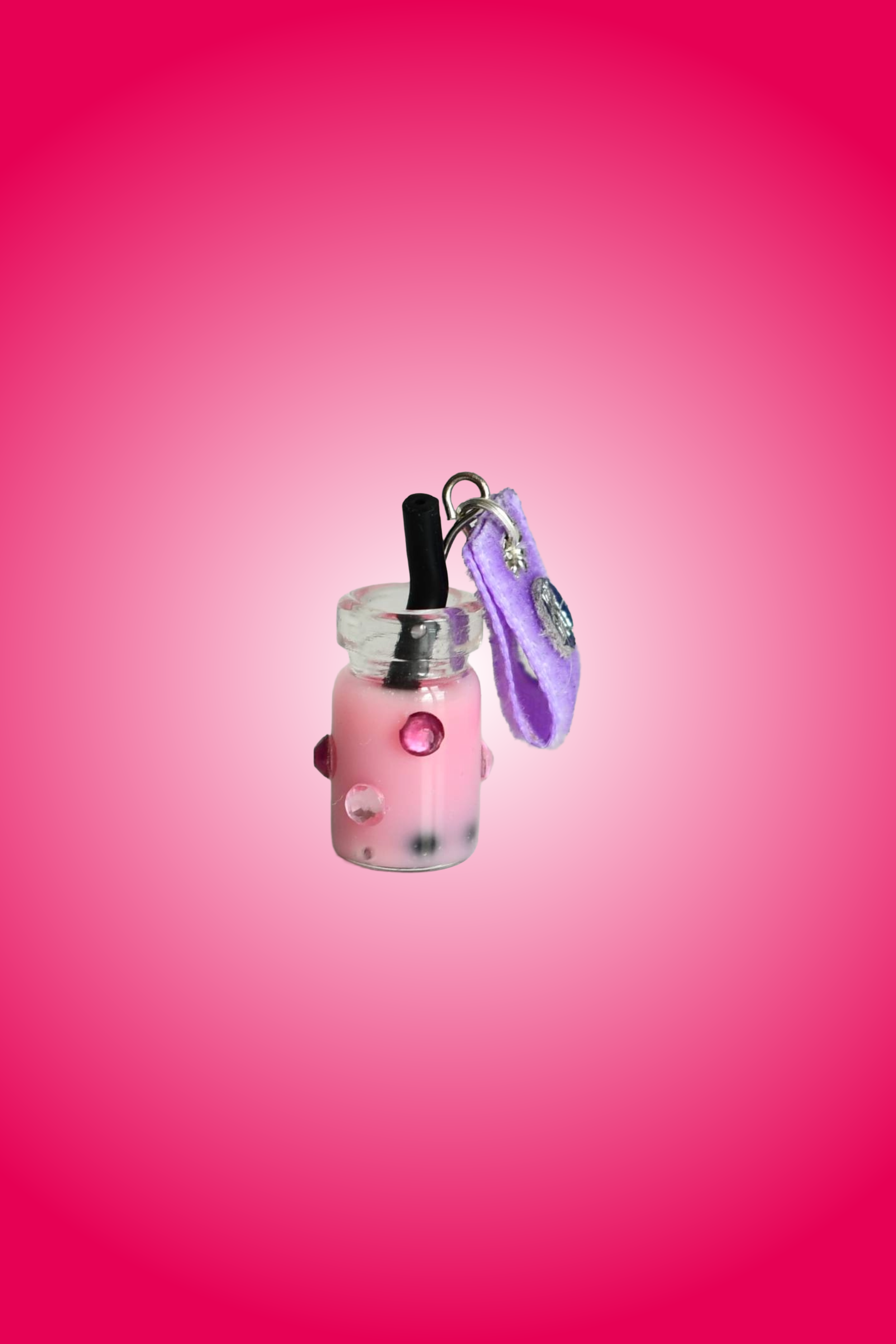 Dragon Fruit Boba Tea Charm attached to purple soft fabric holder