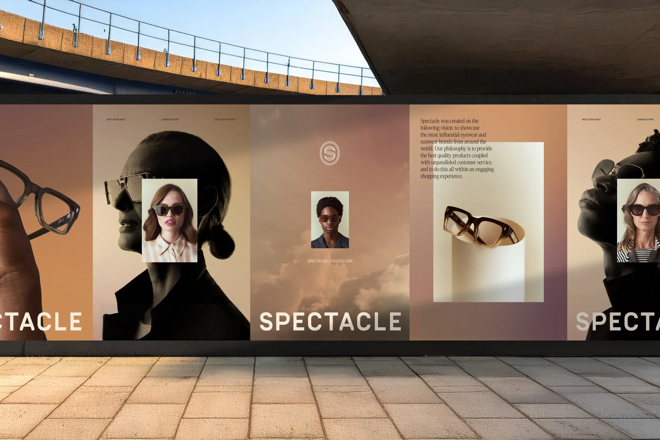 Outdoor billboard advertising eyewear, featuring images of people wearing sunglasses and glasses with large text reading "SPECTACLE".