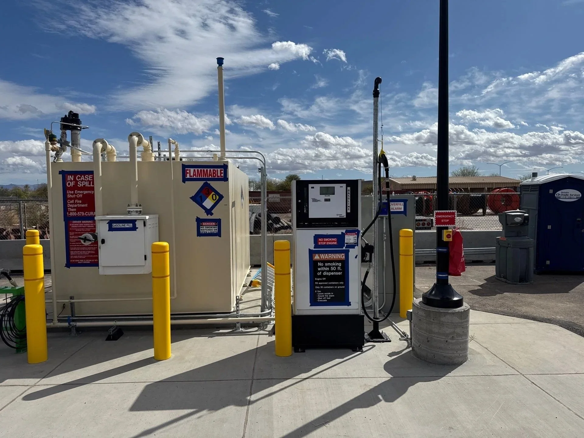 Fuel pumps with InterMountain Fuels, Avis, and Budget signage.