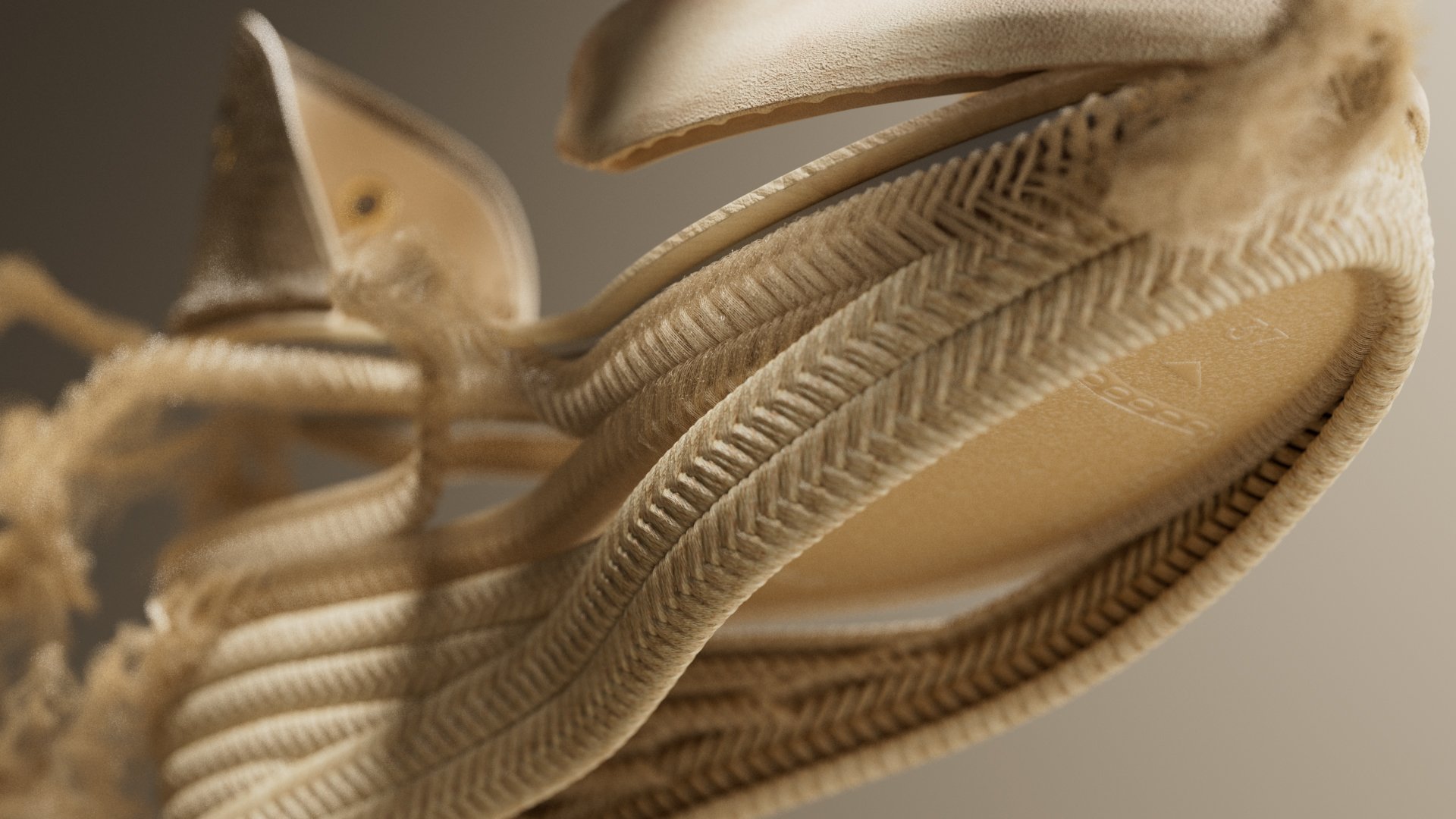 Close-up of a beige sneaker showing the sole and part of the laces.