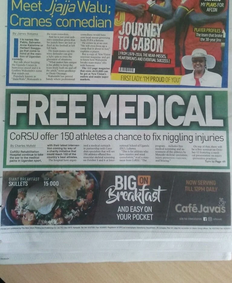 Image of a newspaper page featuring headlines and articles about a comedian named Jjaja Walu and a medical offering by CoRSU for athletes, along with an advertisement for Big Breakfast and Cafe Javas, showcasing a breakfast dish.