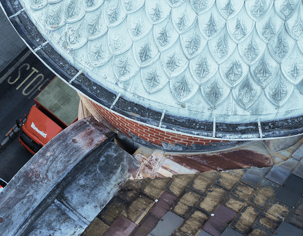 the image shows a victorian dome with fine details and New Oxford Street below