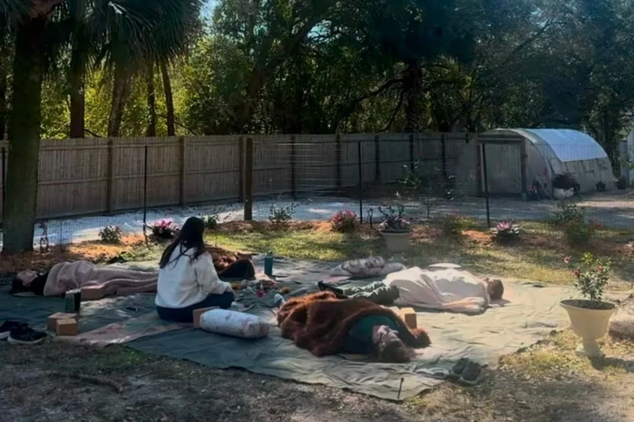 Geometric drawing of an outline square with sections divided by vertical, horizontal, and circle lines.