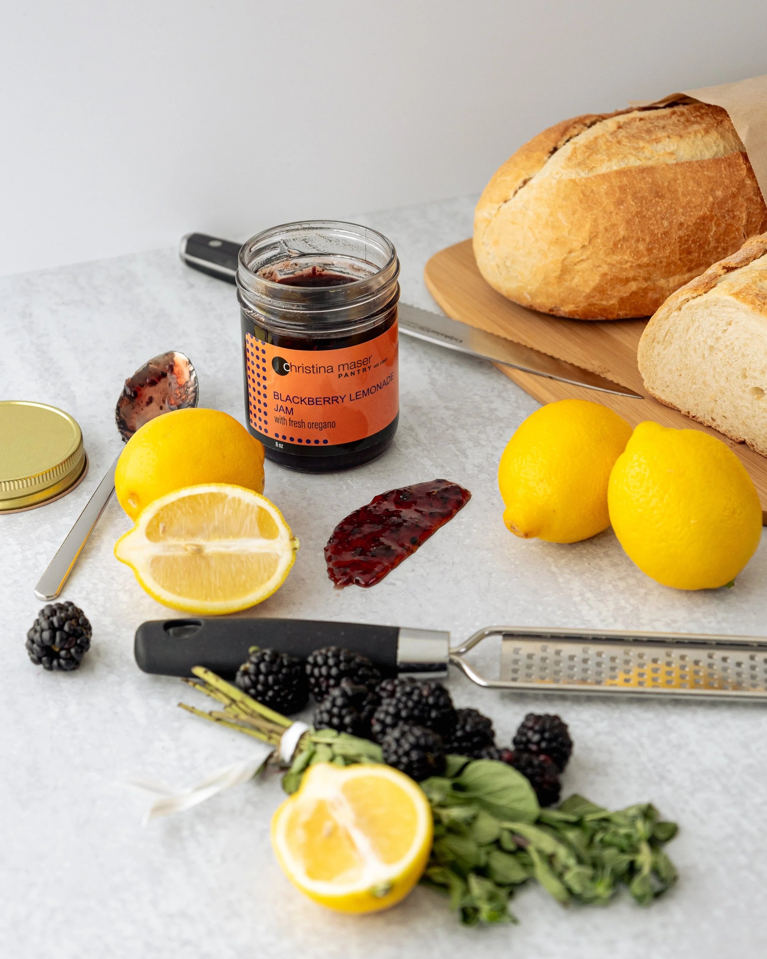 Styled product photography of Christina Maser Co. jar with fresh ingredients
