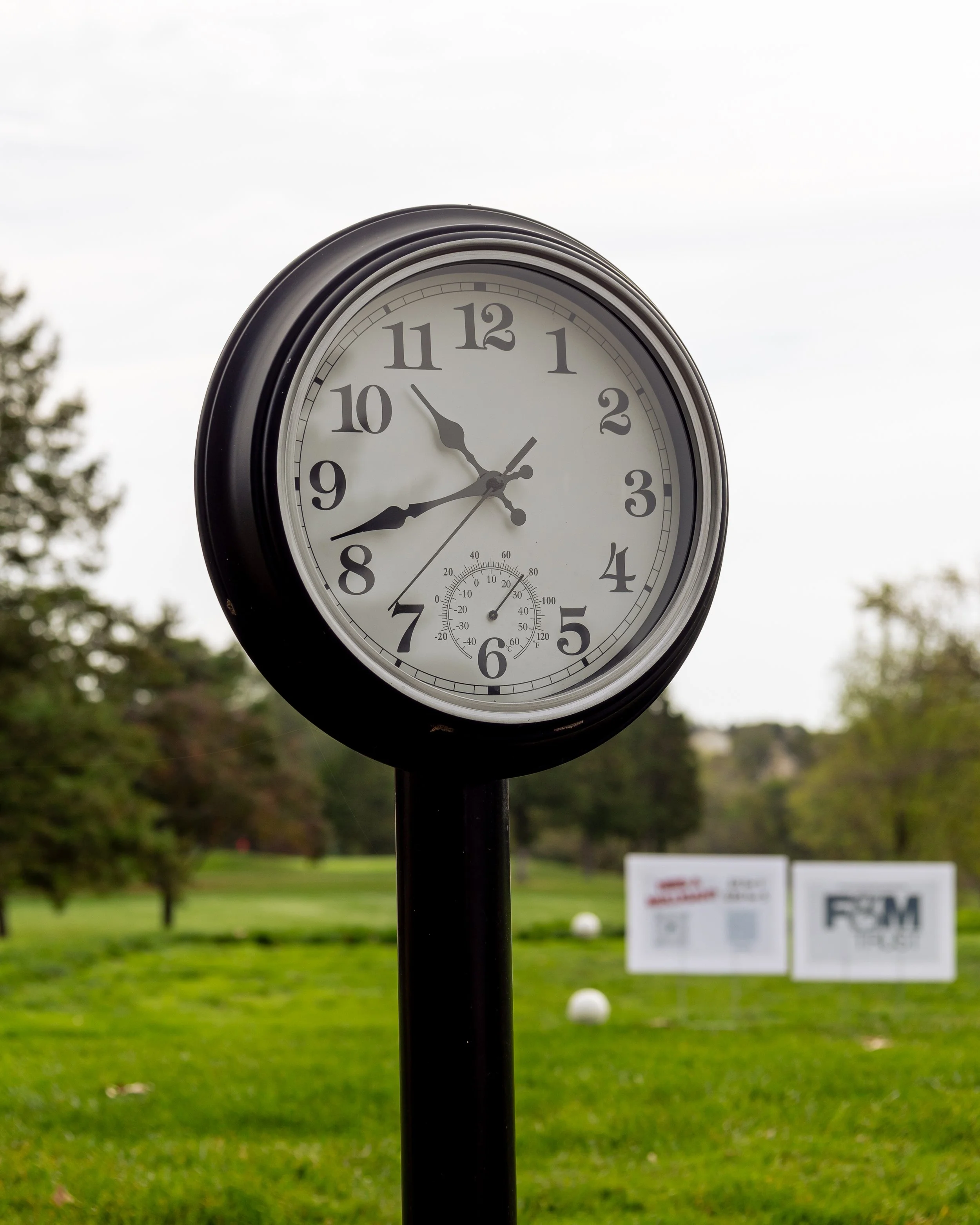 Event photography from a nonprofit golf outing, documenting golfers, course details, group moments, and candid interactions throughout the day in a natural, documentary style.