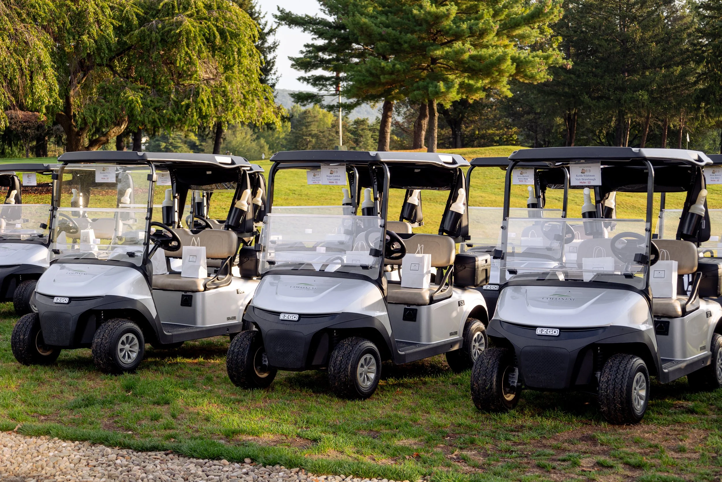 Event photography from a nonprofit golf outing, documenting golfers, course details, group moments, and candid interactions throughout the day in a natural, documentary style.