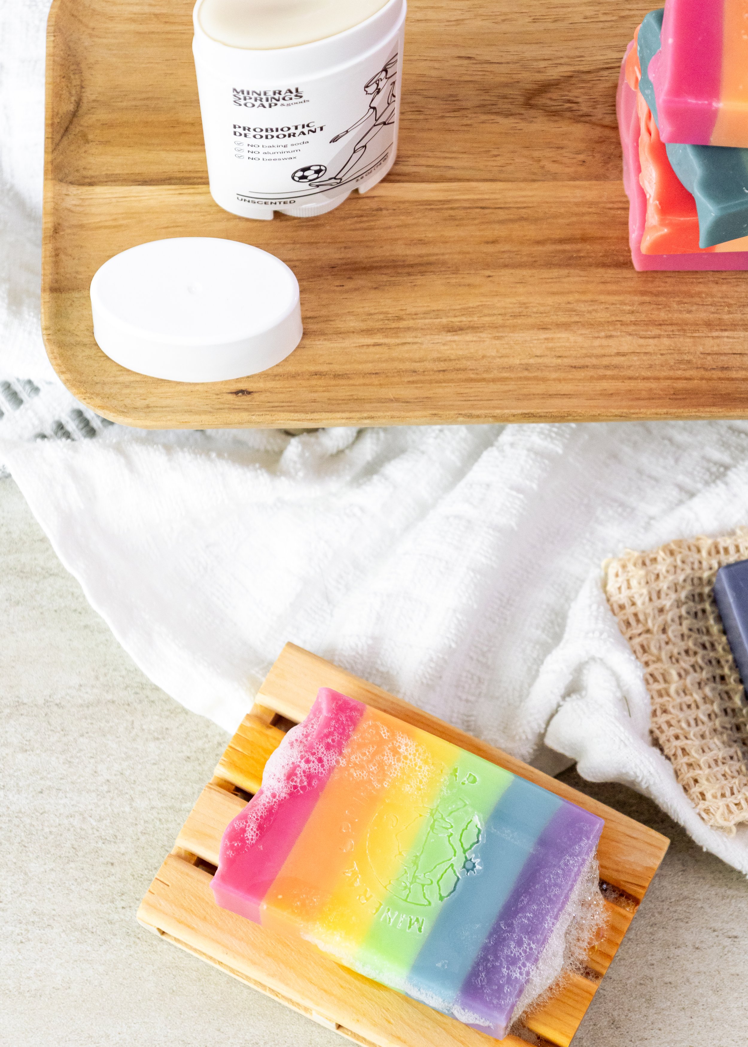 Product photography of handcrafted Mineral Springs Soaps highlighting layered colors, texture, and detail in clean, natural styling.