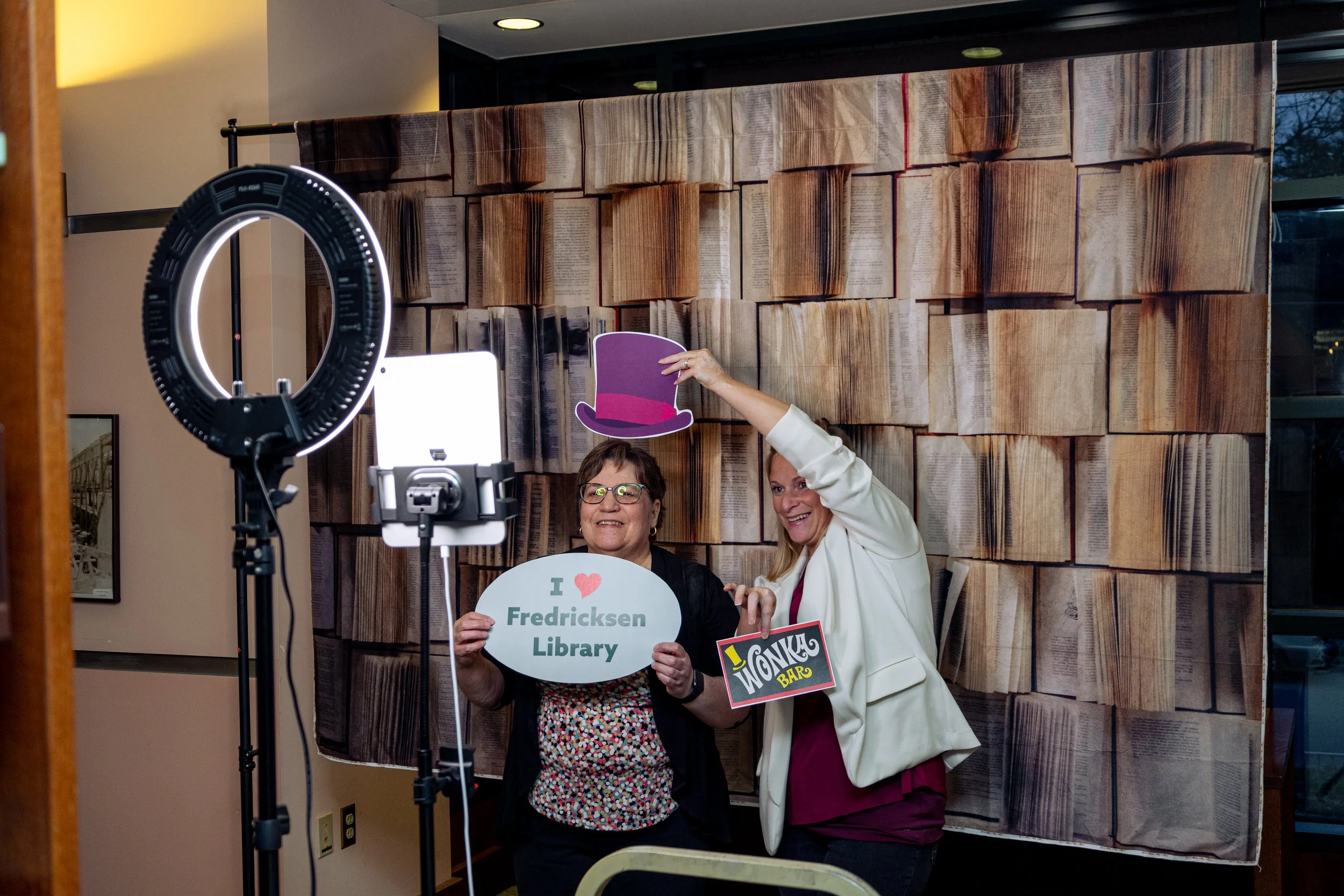 Picture of guests enjoying the photo booth station at the Cleve J. Fredricksen Library Night at The Library Event