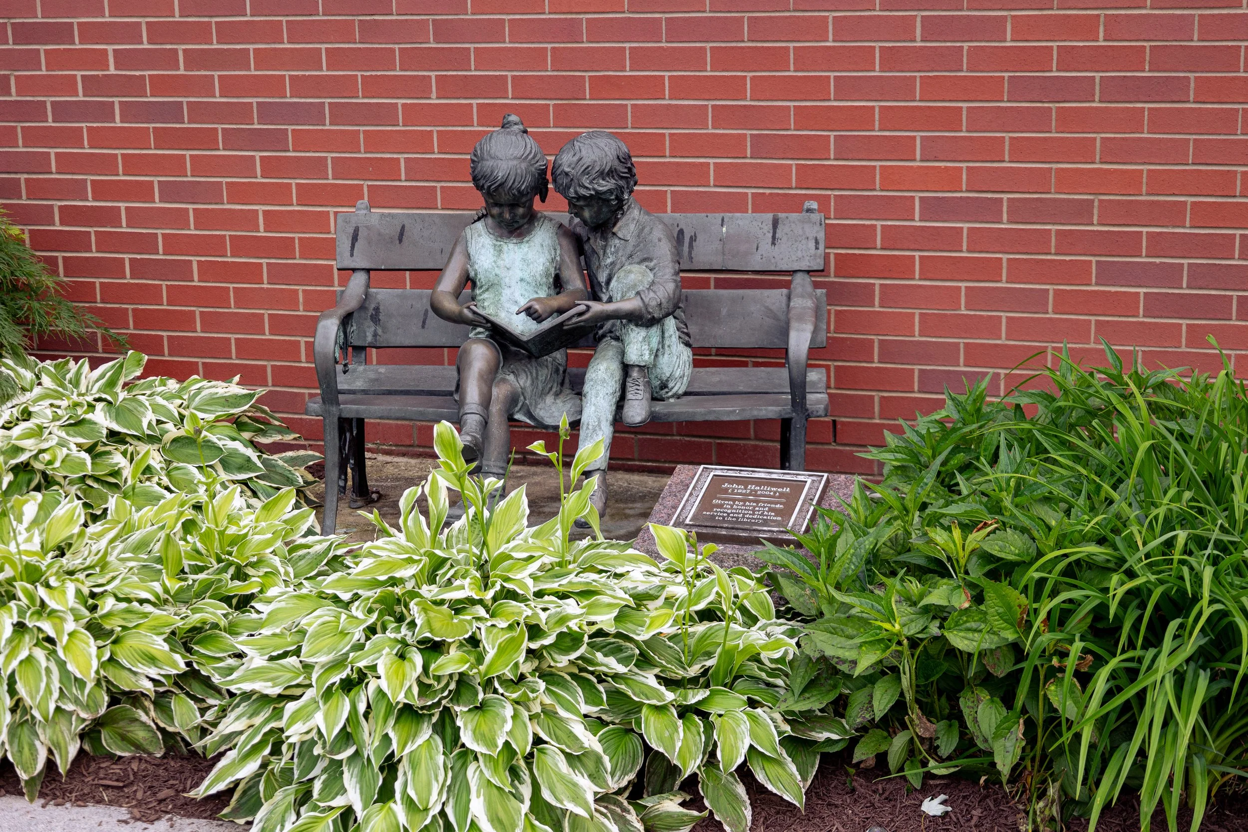 Cleve J. Fredricksen Library outside statue