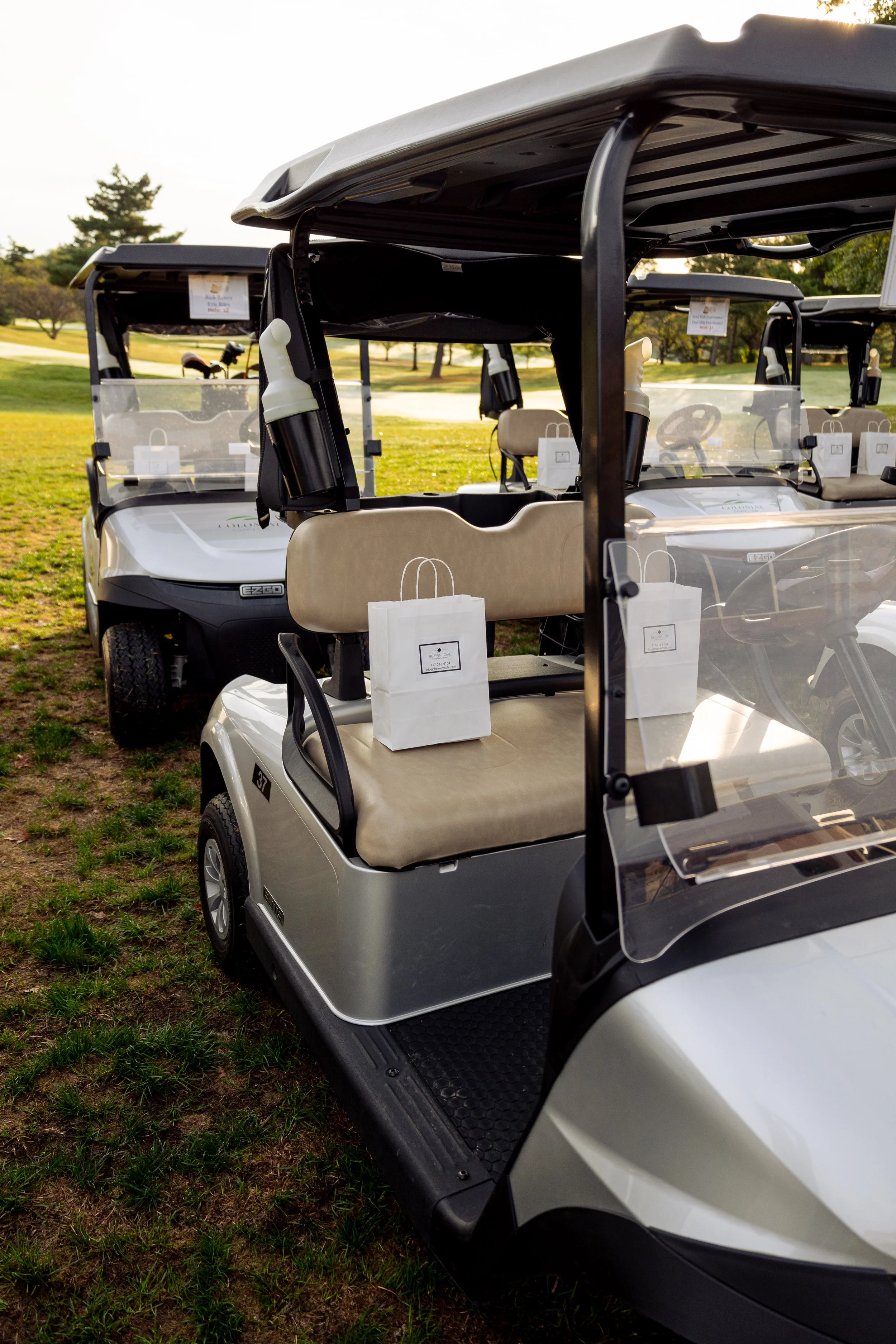 Event photography from a nonprofit golf outing, documenting golfers, course details, group moments, and candid interactions throughout the day in a natural, documentary style.