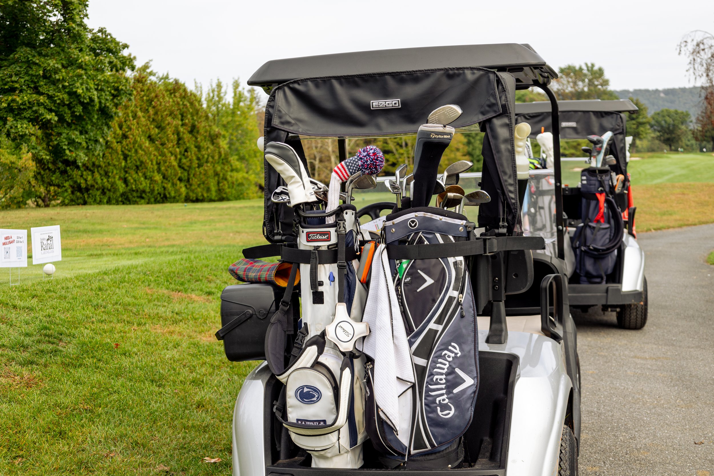 Event photography from a nonprofit golf outing, documenting golfers, course details, group moments, and candid interactions throughout the day in a natural, documentary style.