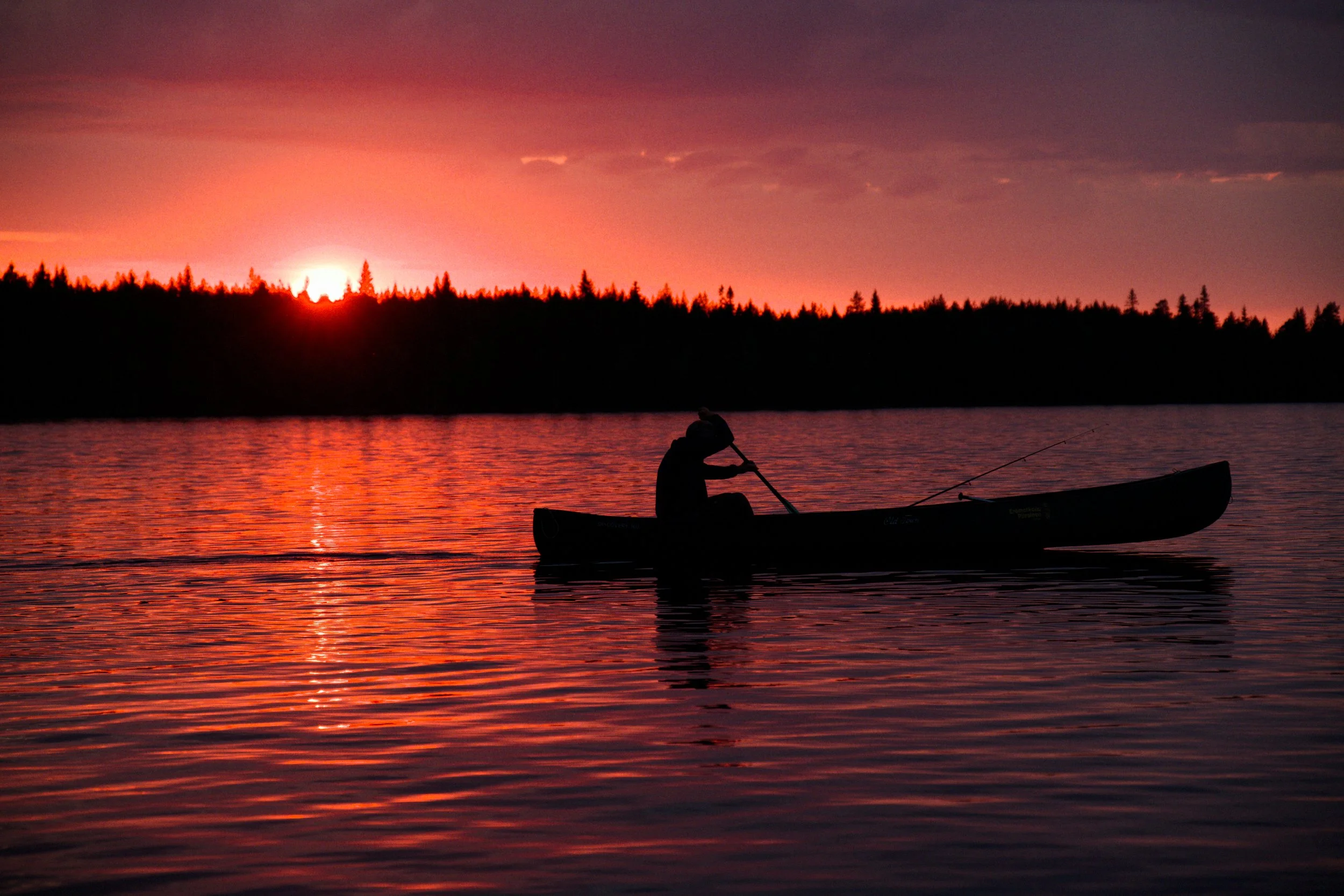 Canoeing at sunset in Finland