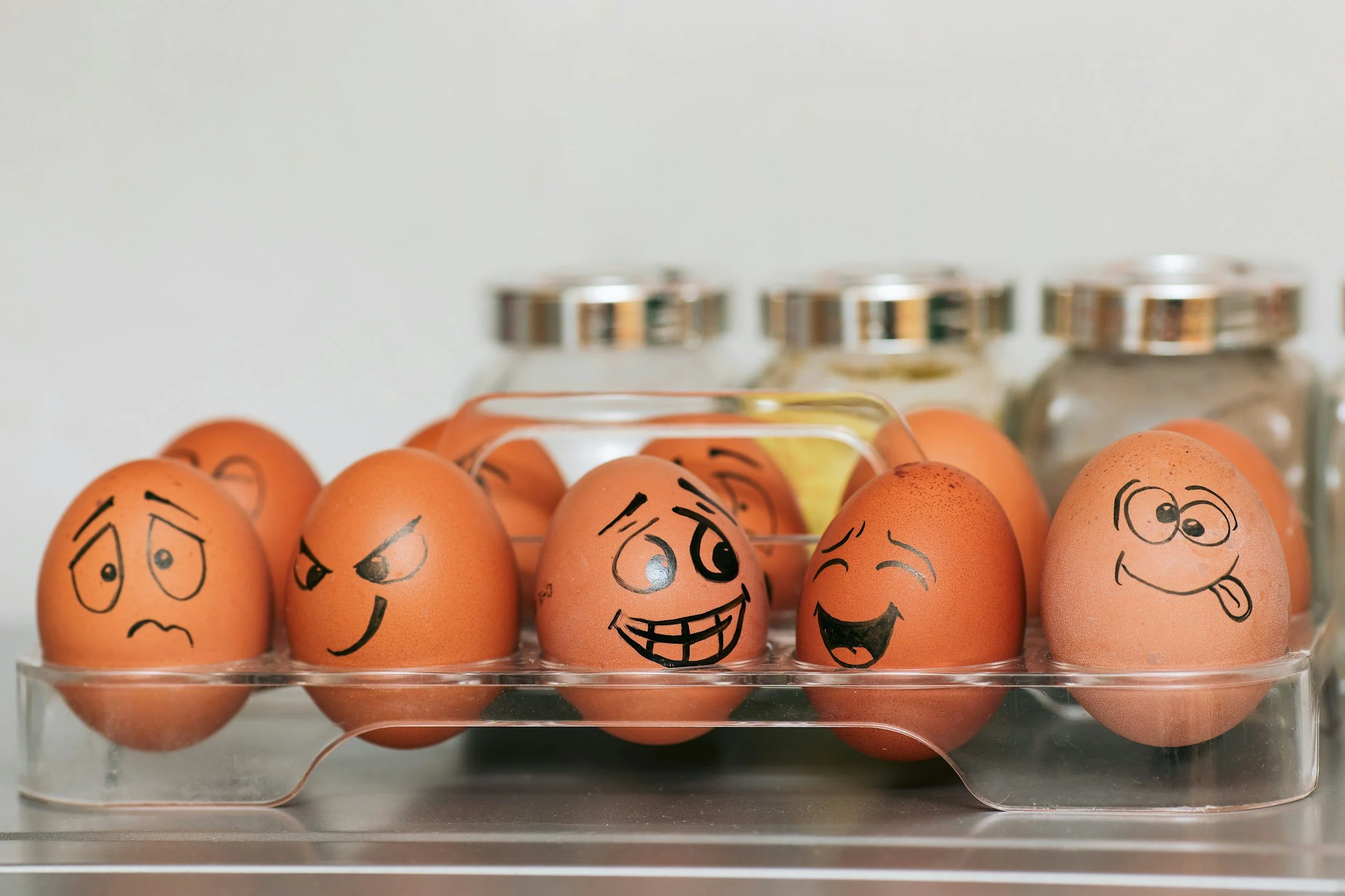 eggs with different faces drawn on them
