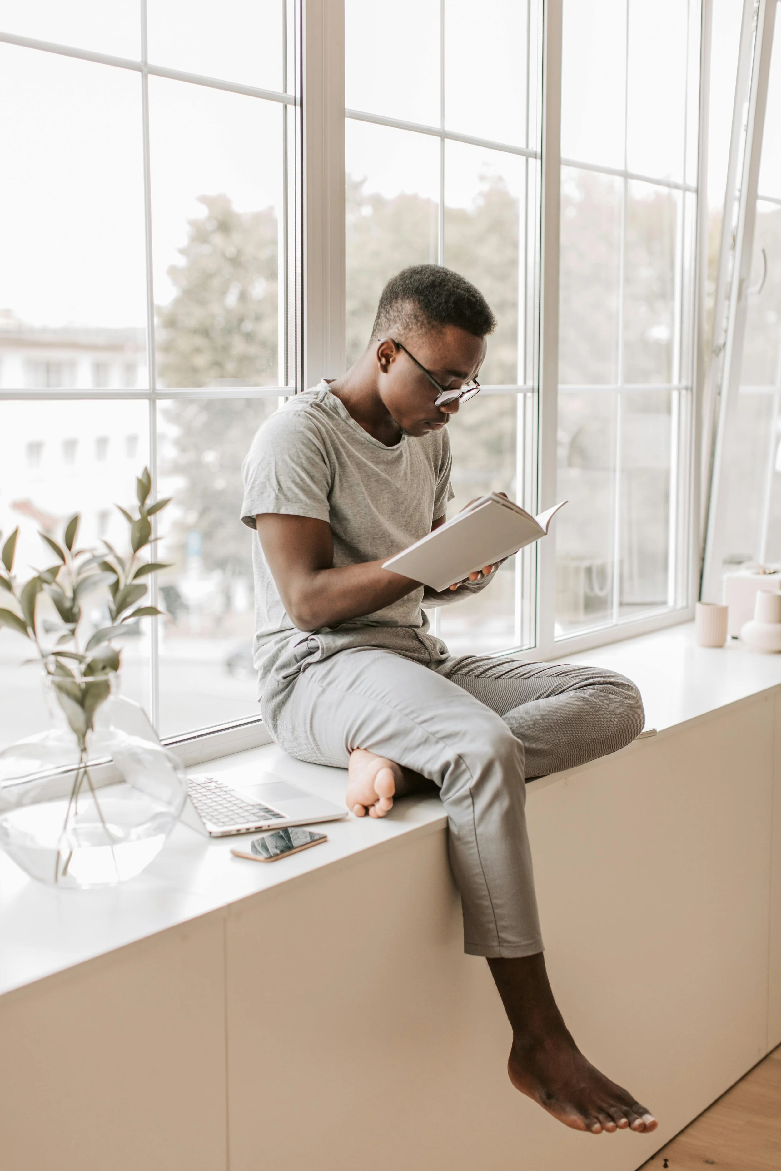 A Learning Coach taking notes on a windowsill