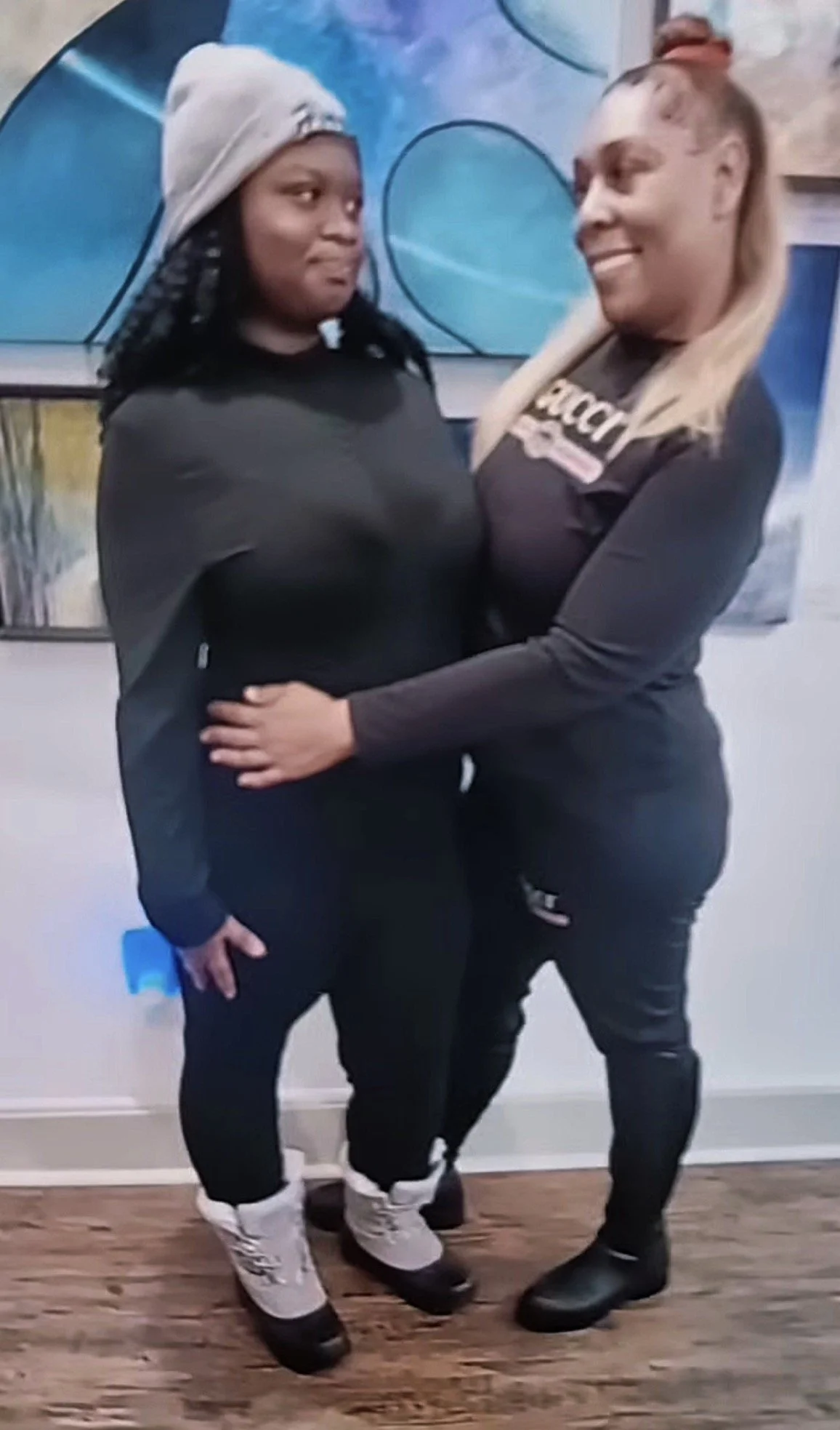 Leylianna and Angelina smiling at each other