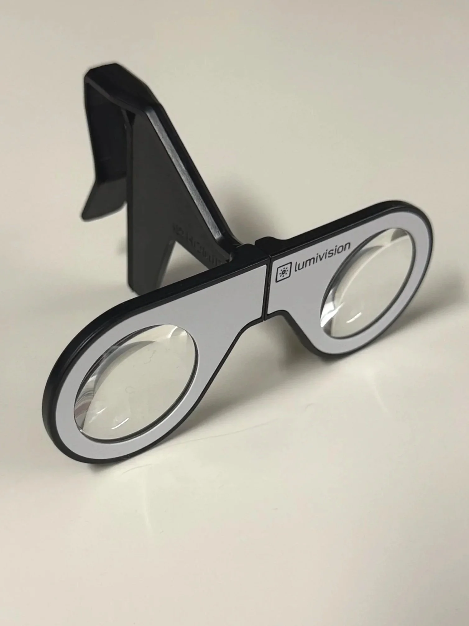 above image of small VR headset and connector piece