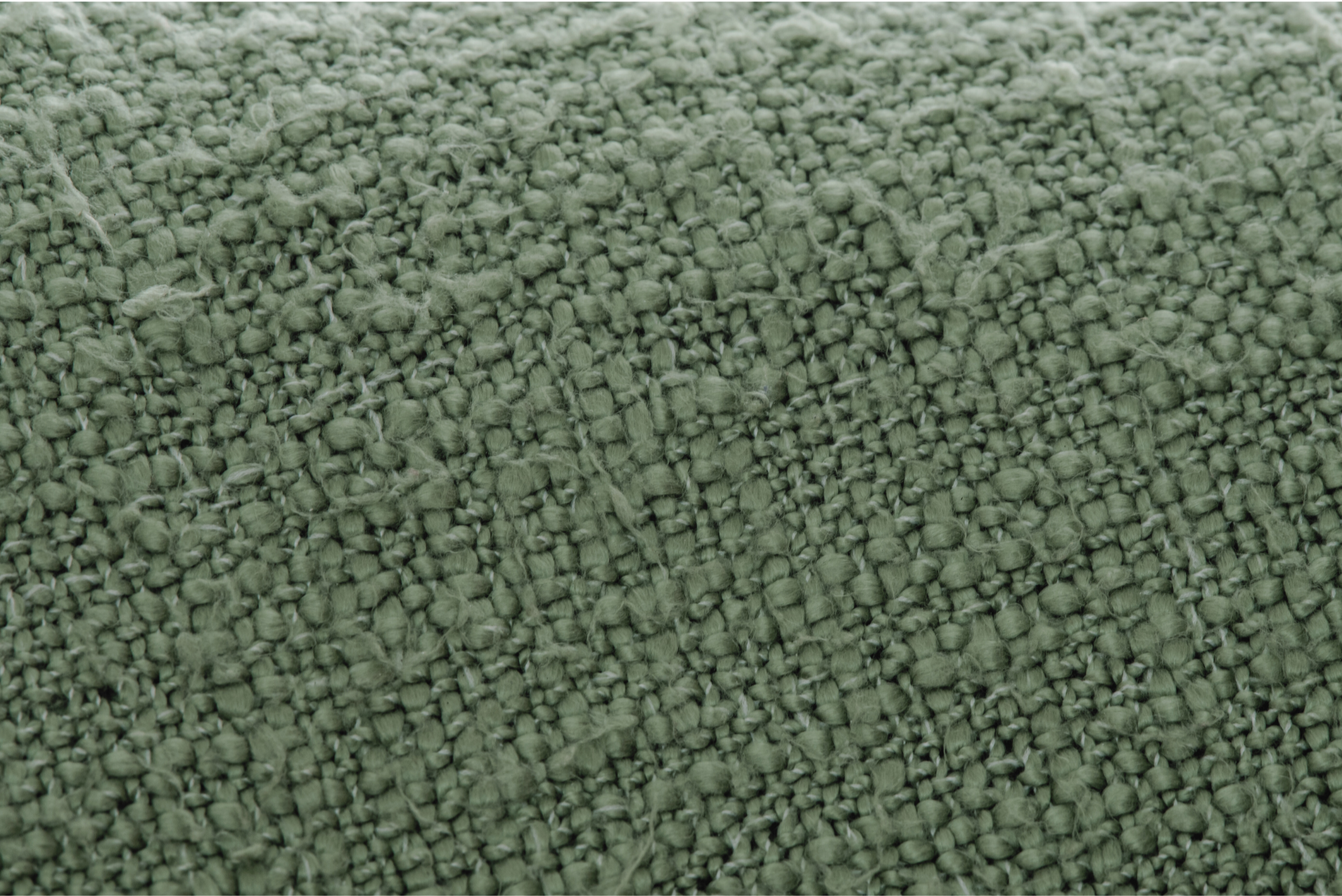 Close-up of a green textured fabric.