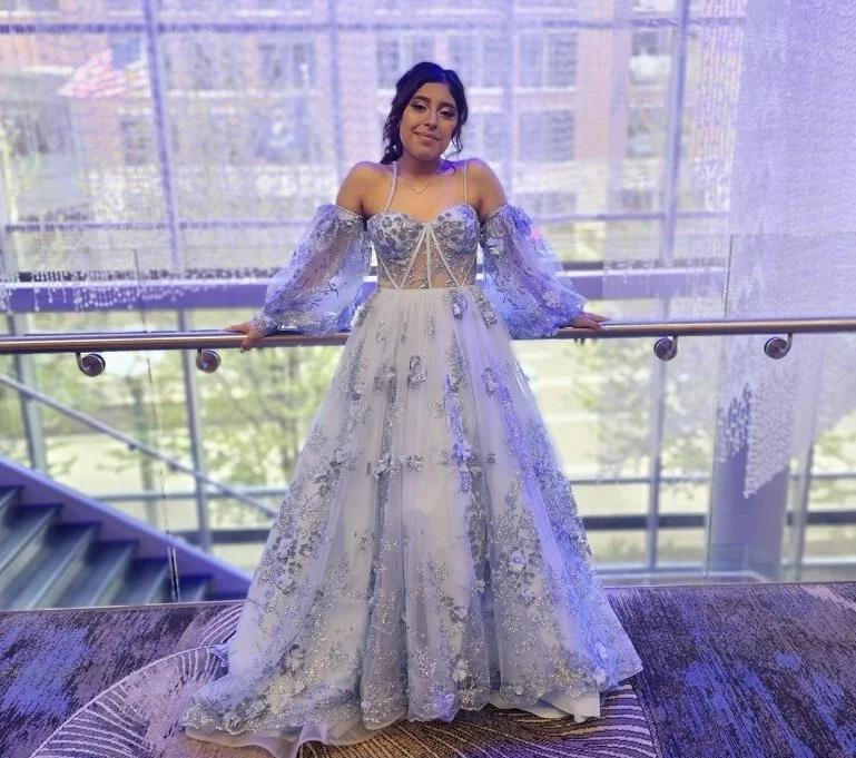 Client wearing a formal gown after alterations in the Grand Rapids area