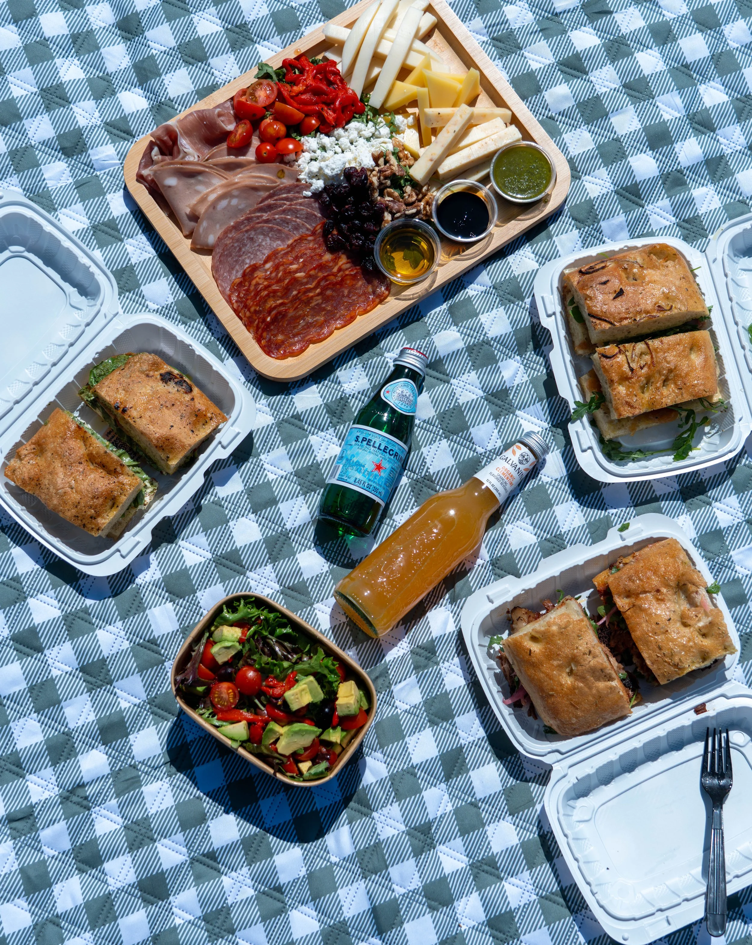 Zay'z Artisanal Deli catering picnic with sandwiches, salads, charcuterie, and fresh house-made food in Newport Beach.