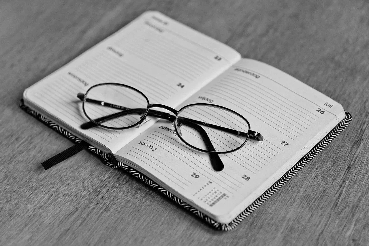Diary with glasses on top