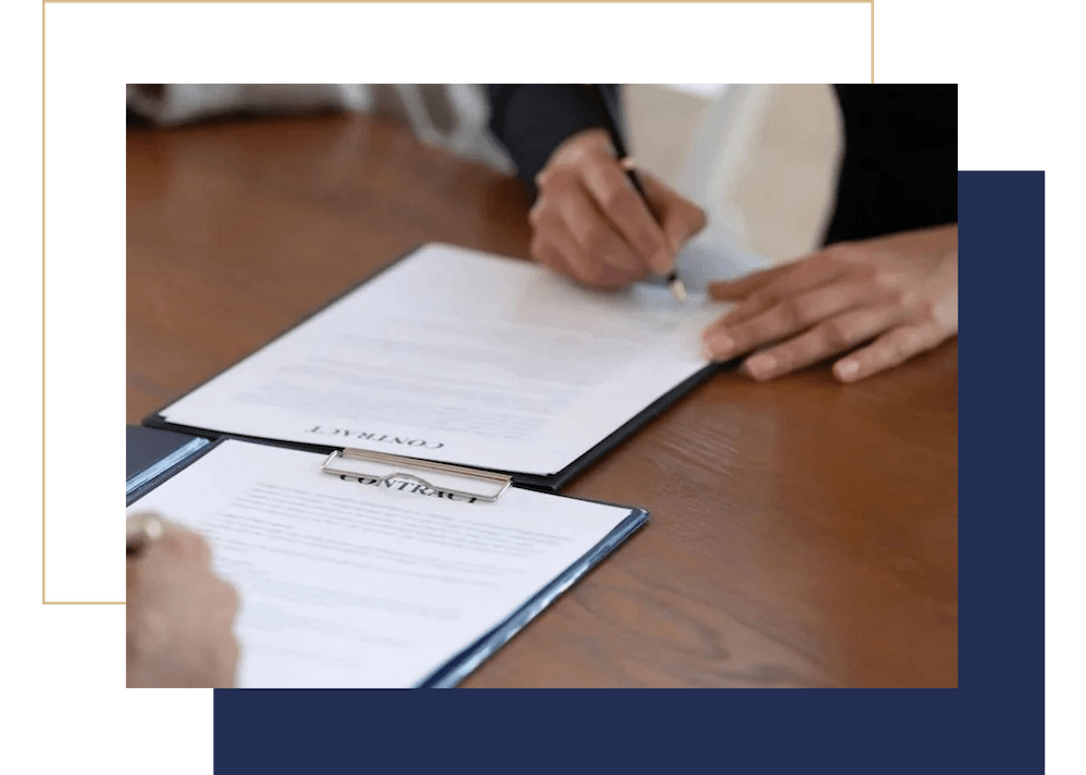 Two people signing professional business documents prepared by Russell Partners LLC in Newton, MA.