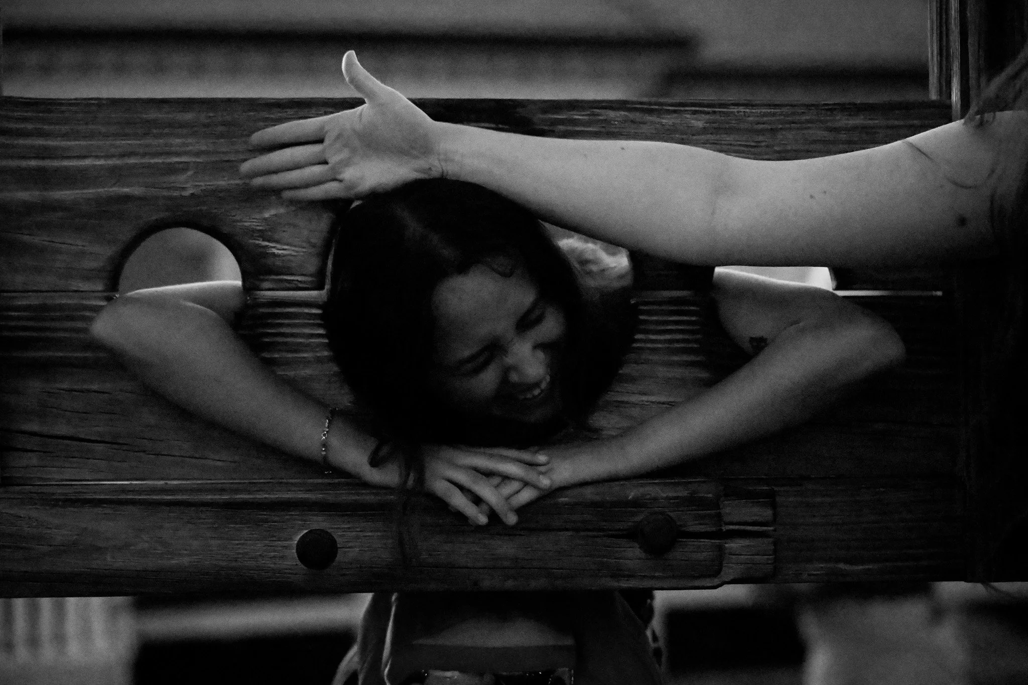 A black and white photos of a woman in the gallows.