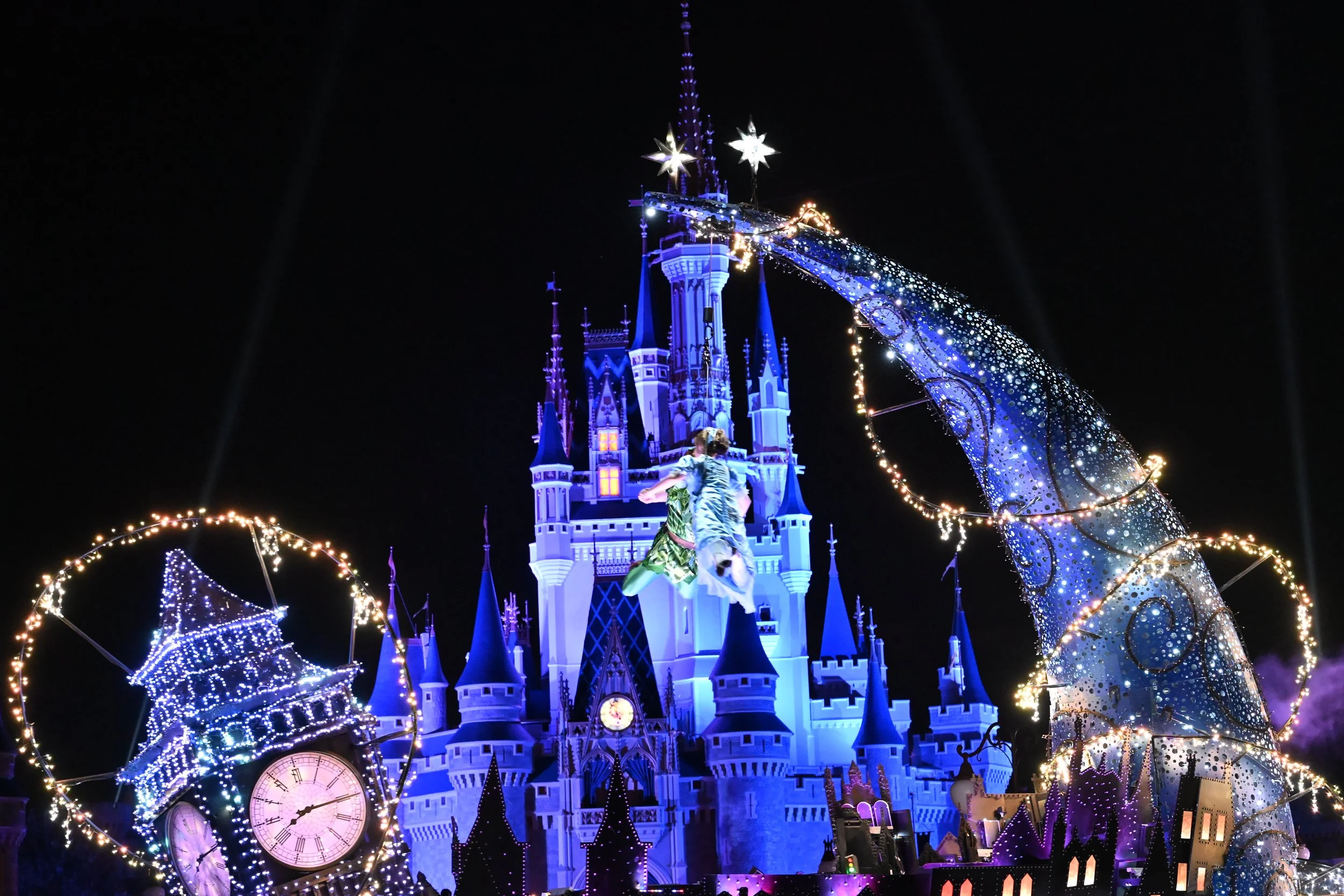 Peter and Wendy Flying Infront of Cinderella castle during the Disney Starlight Parade