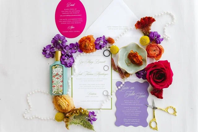 bold color flat lay purple, red, hot pink and orange