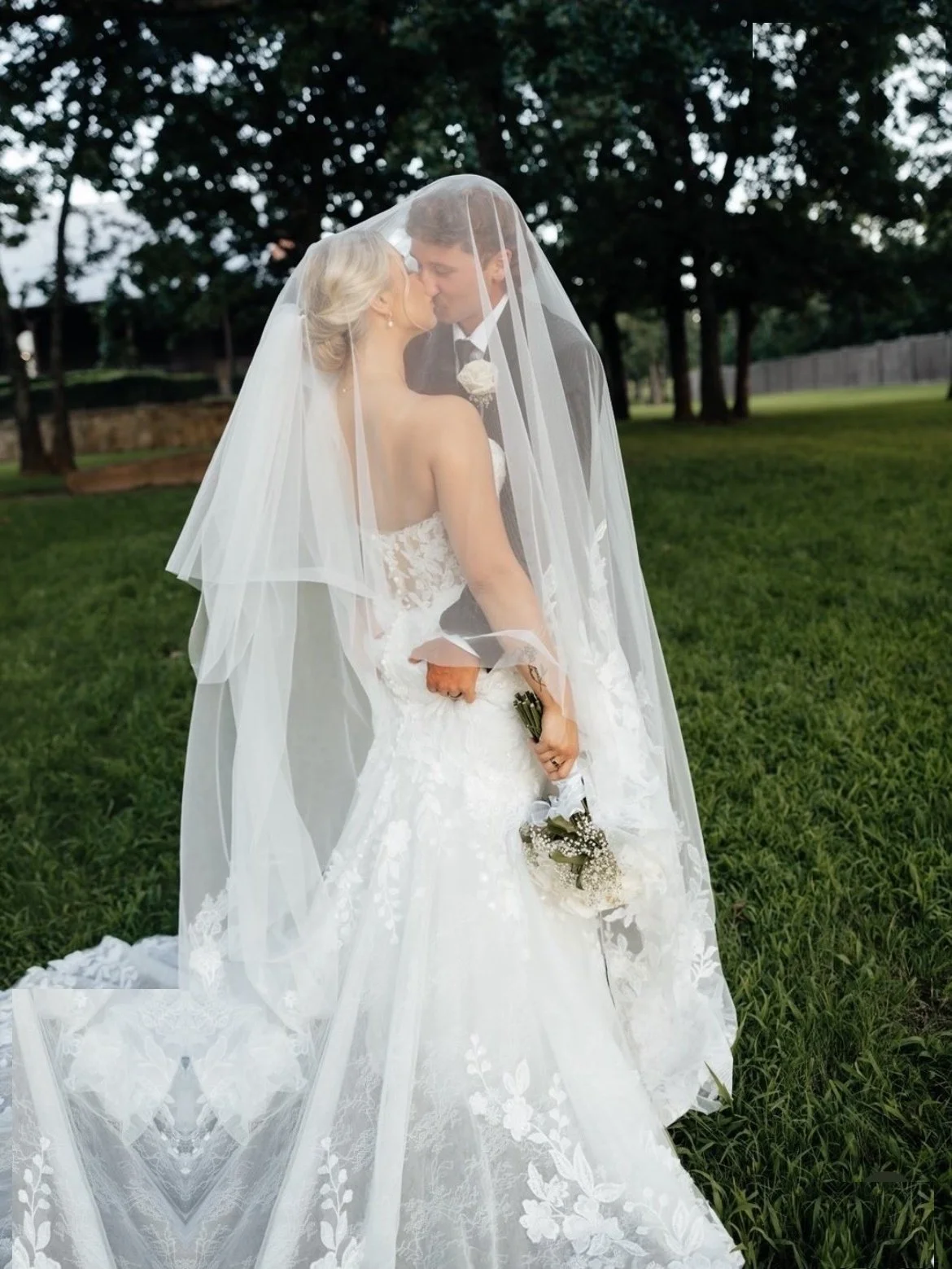Bride and groom kissing beneath her veil at The Springs wedding venue