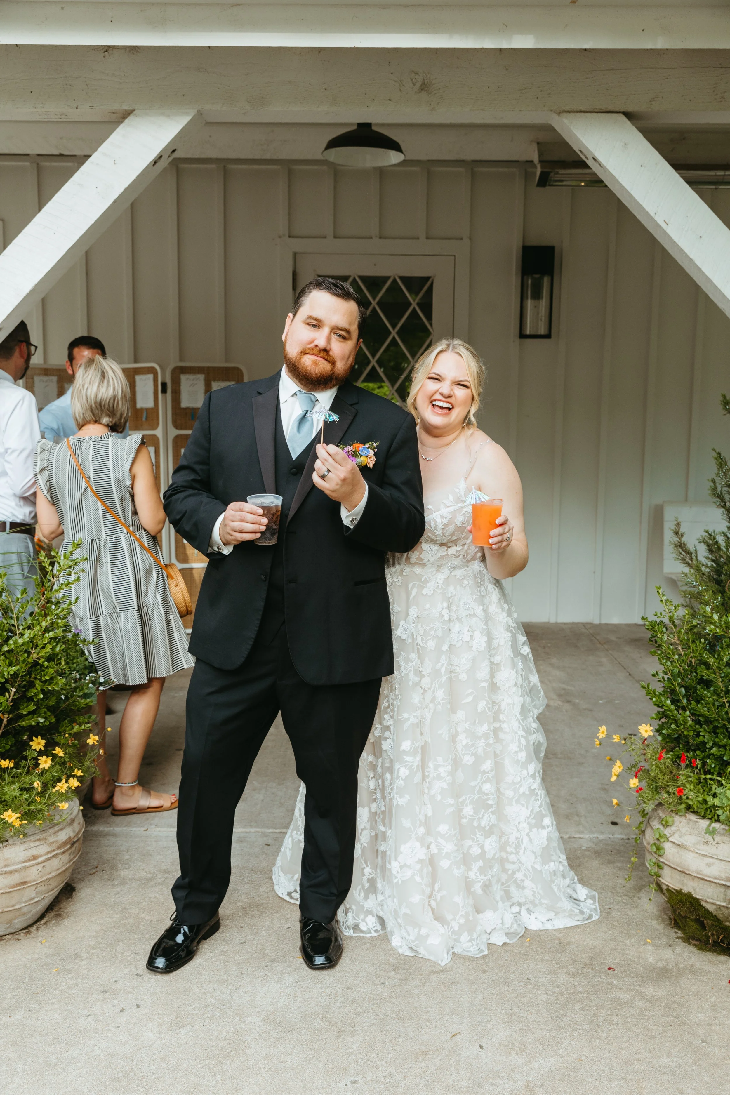 happy couple enjoying cocktail hour with signature drinks