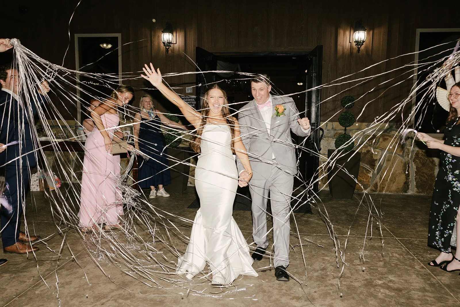 couple grand exit with streamers
