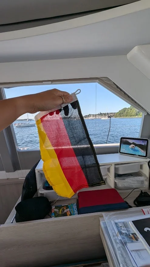 Our first time hoisting a courtesy flag - Hello Germany!