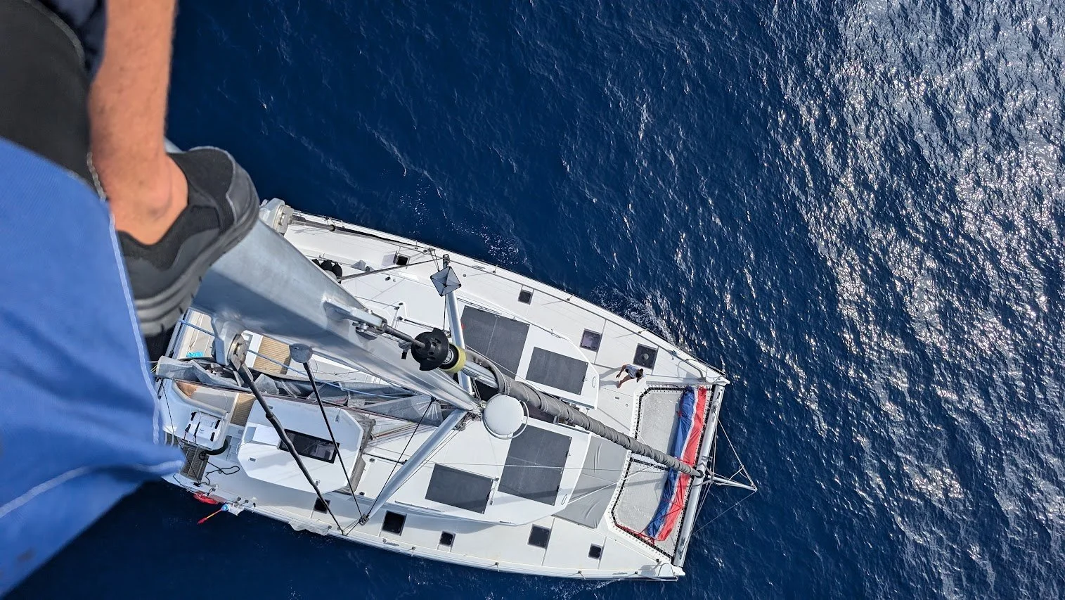 A shot Nico took from up the mast as we tried to sort out chafe in the halliard. Even in calm seas, the boat was rocking a lot from up there!