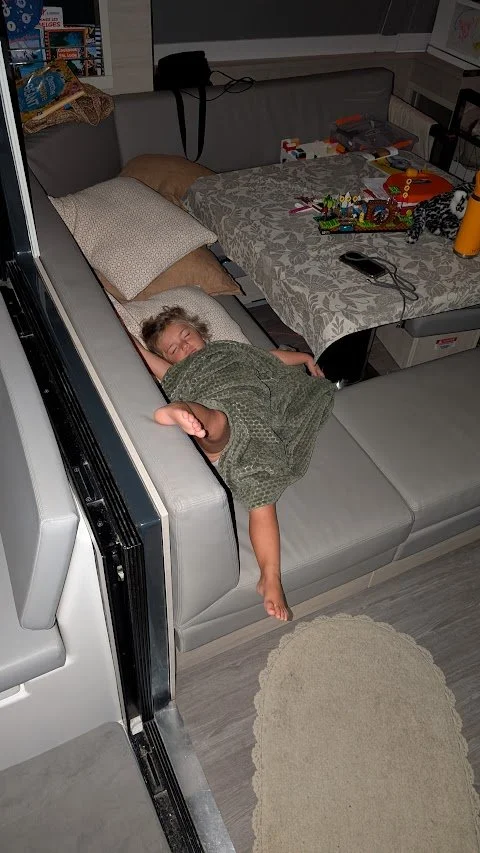 Given we had started sailing double handed for the first time, Maddie was not happy with my late night shifts and decided to sleep in the galley whilst keeping an eye on mum at the helm!