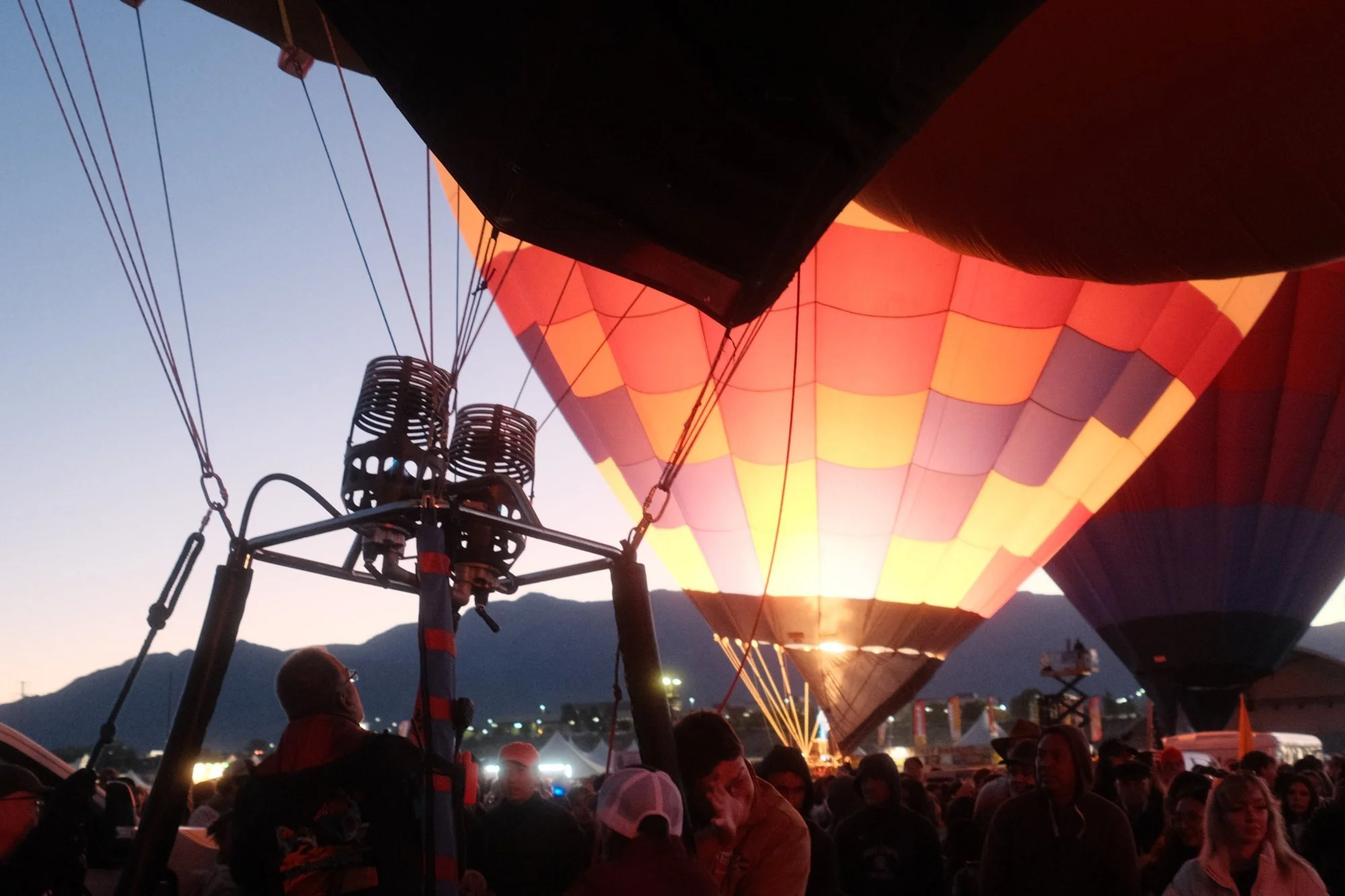 A balloon glowing as it inflates at dawn