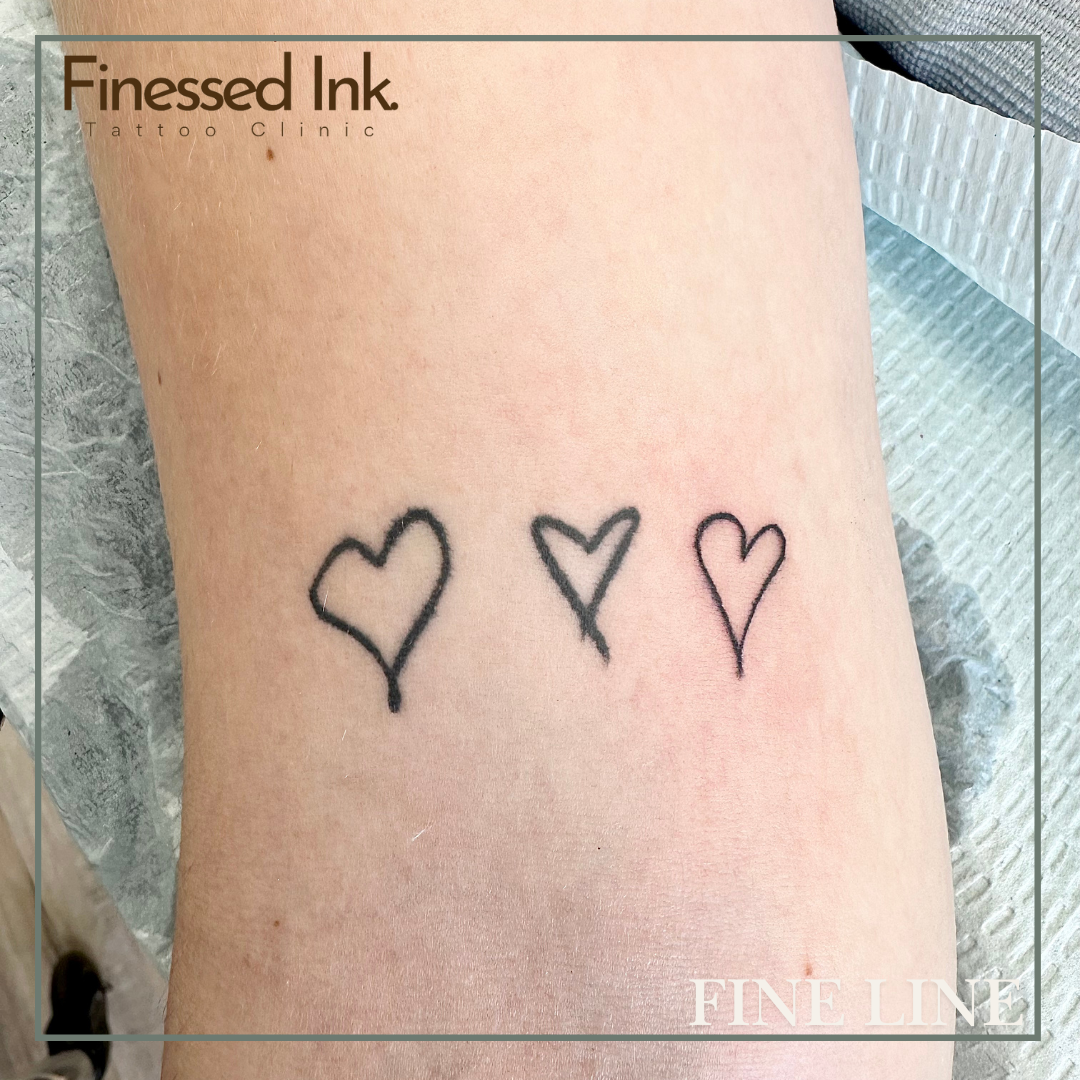 Fine line tattoo hearts.png