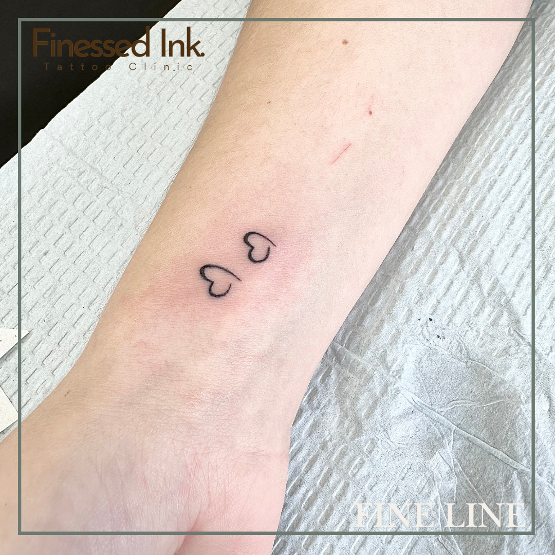 Fine line tattoo hearts.png