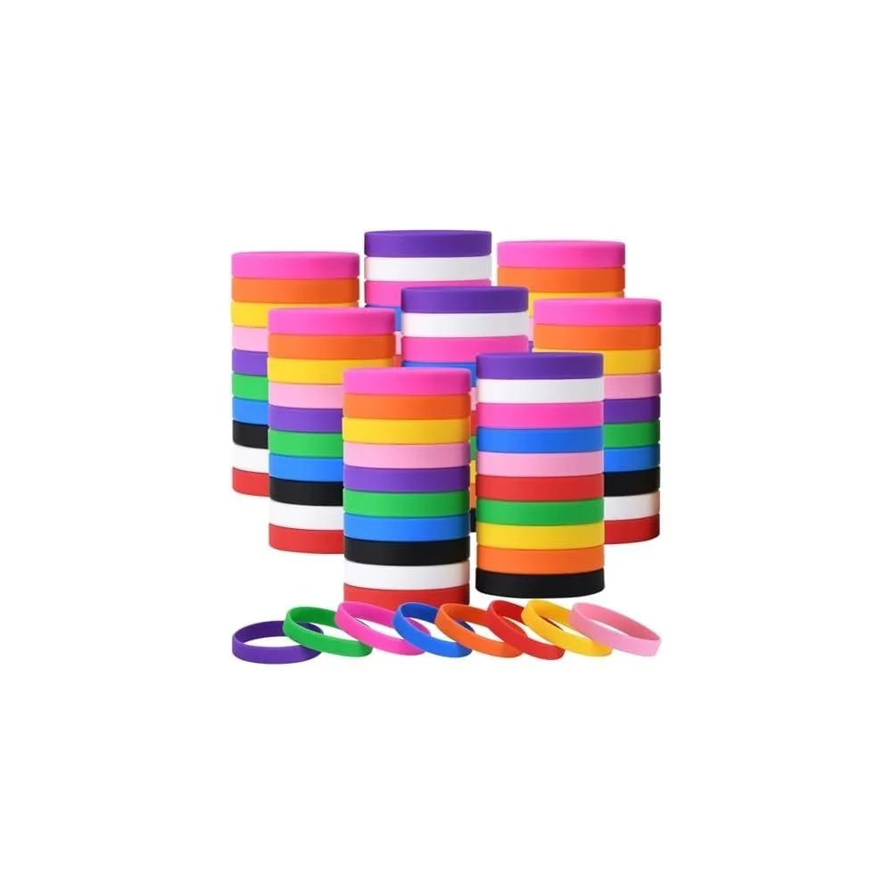 Multiple stacks of colorful rubber bracelets on a white background.