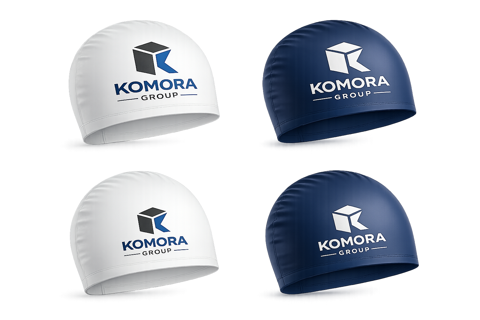 Four swim caps with the 'KOMORA GROUP' logo, two in white and two in navy blue, arranged in the image.