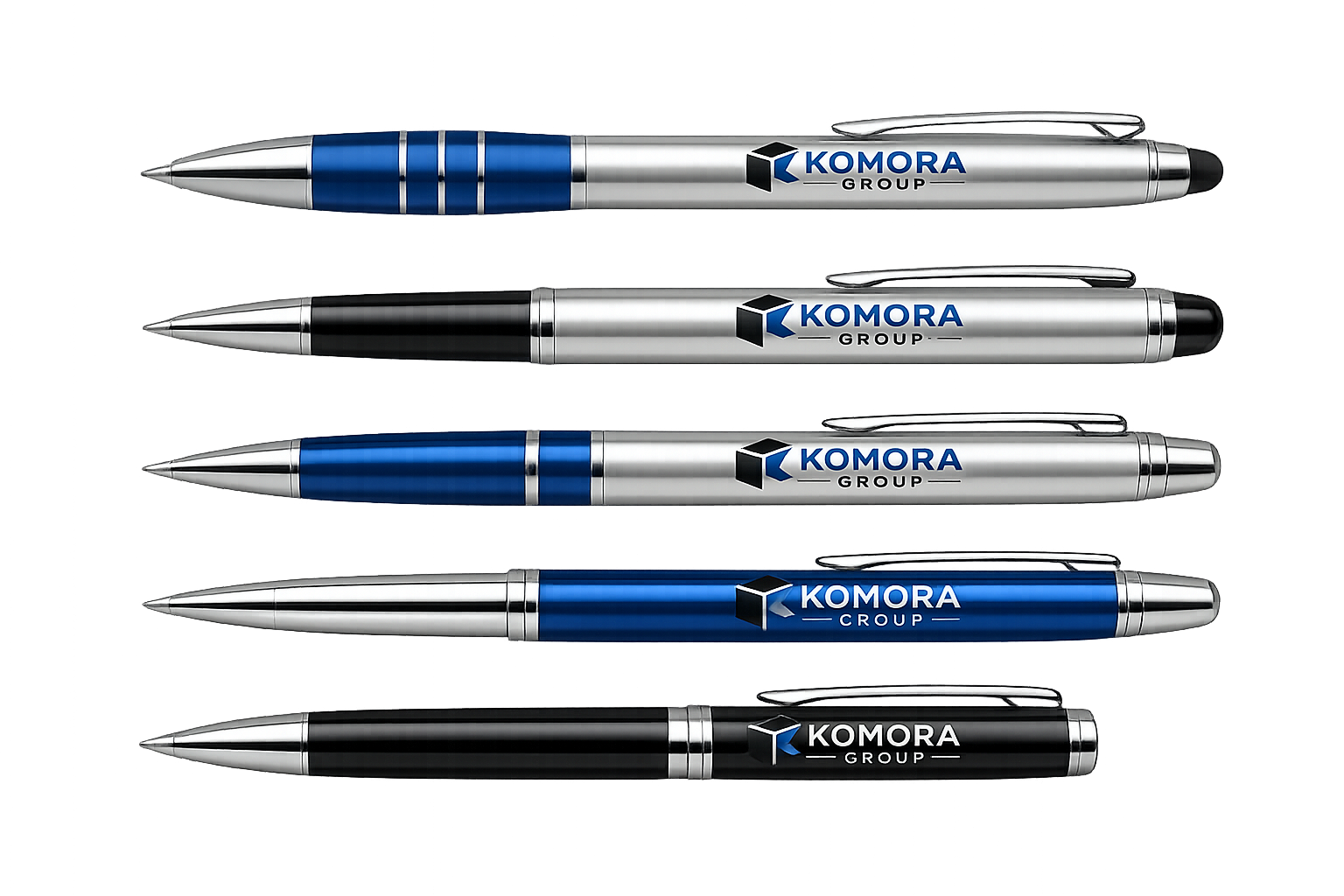 Four metallic ballpoint pens with the logo and name 'KOMORA GROUP' in black and blue on their bodies, arranged horizontally on a surface, with the top and third pens in silver with blue accents, and the second and bottom pens in black with silver accents.