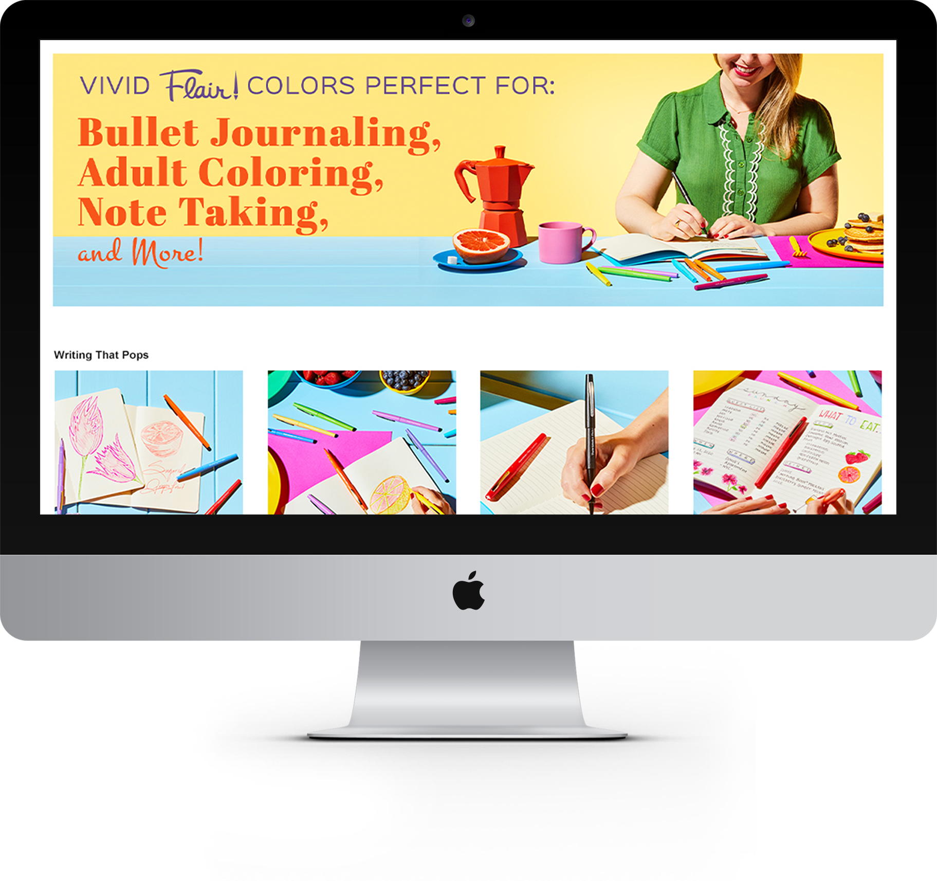 Computer screen displaying colorful stationery and notebooks with a poster promoting vibrant products for bullet journaling, adult coloring, and note taking.