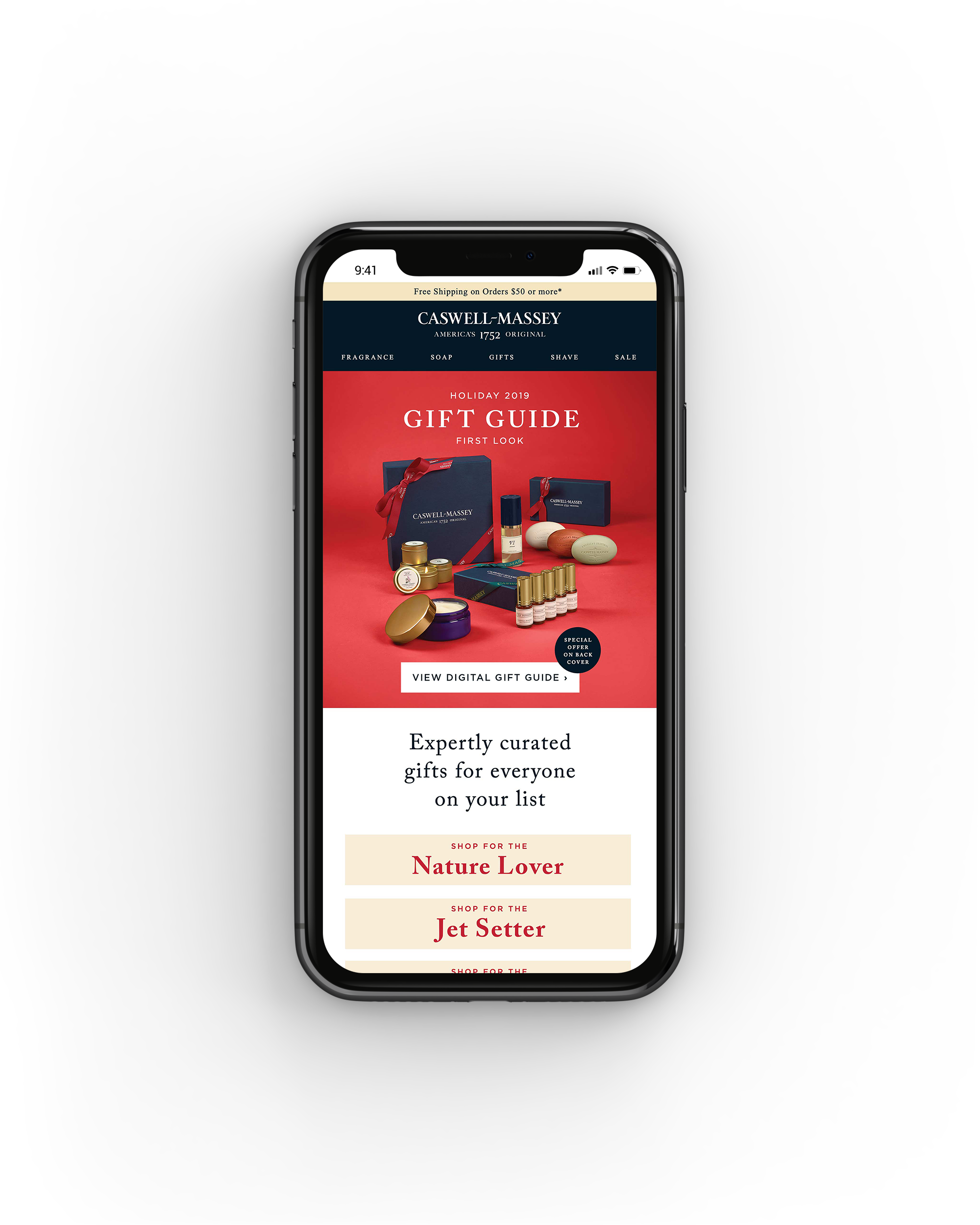 A smartphone displaying a holiday gift guide from Caswell-Massey with various skincare and soap products on a red background.