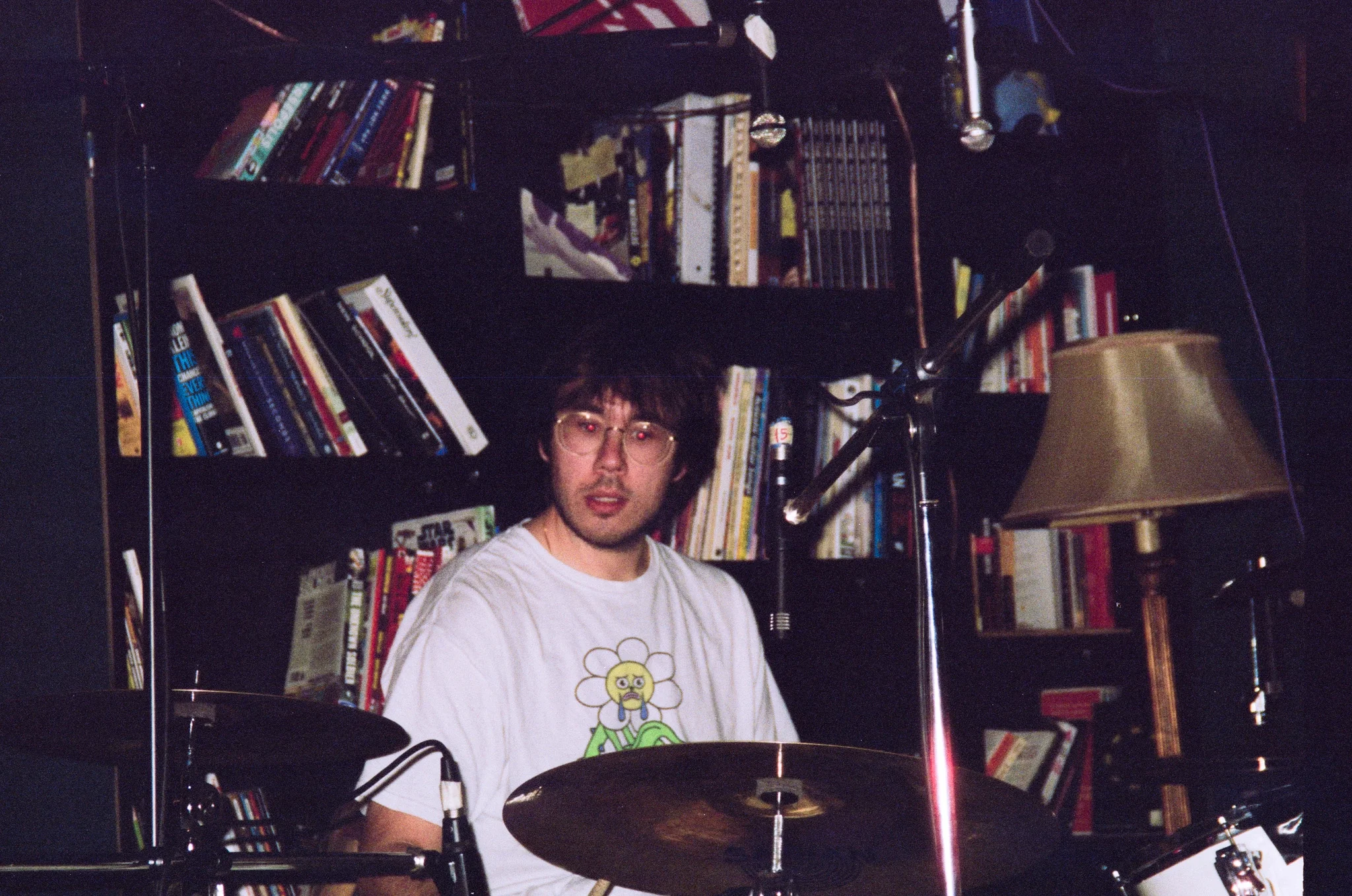 Nicholas Charuk tuning a drum kit during a recording session.