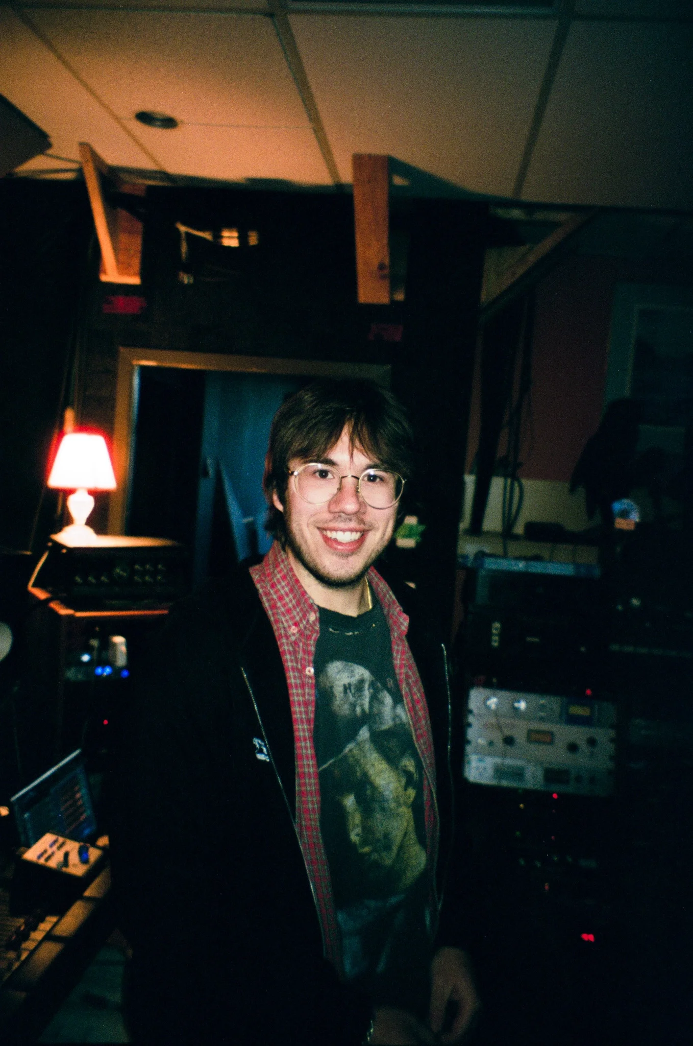 Nicholas Charuk smiling during a recording session for Cal State Football Stadium.