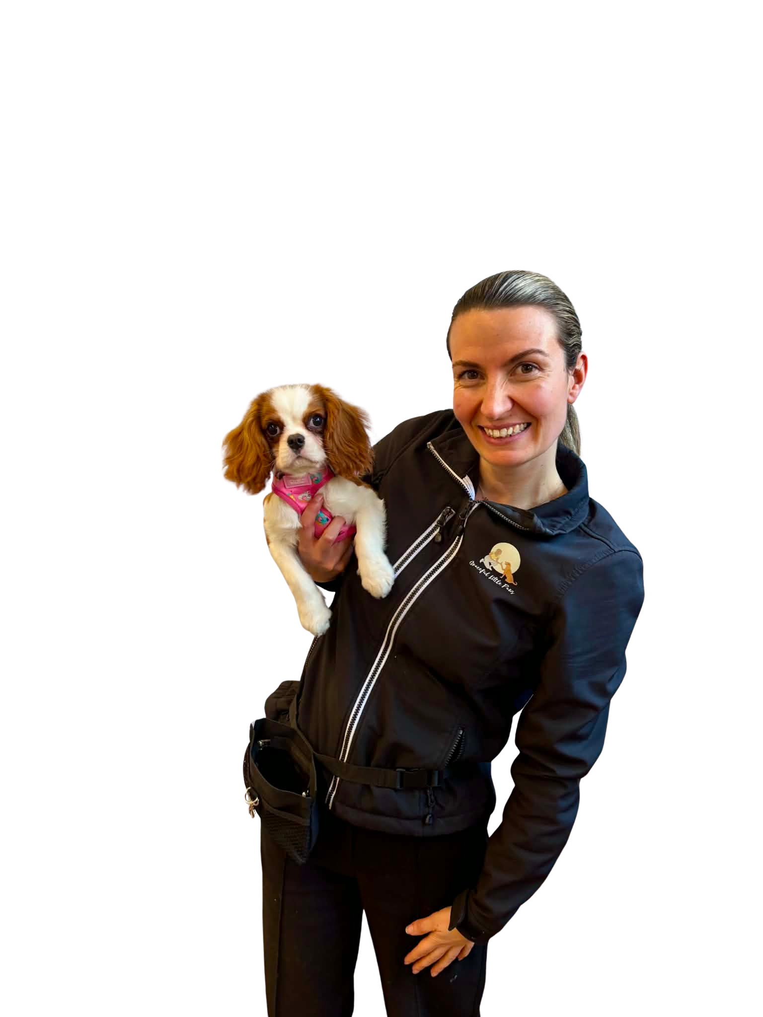 Grace, founder and Melbourne dog trainer at Graceful Little Paws, holding a puppy