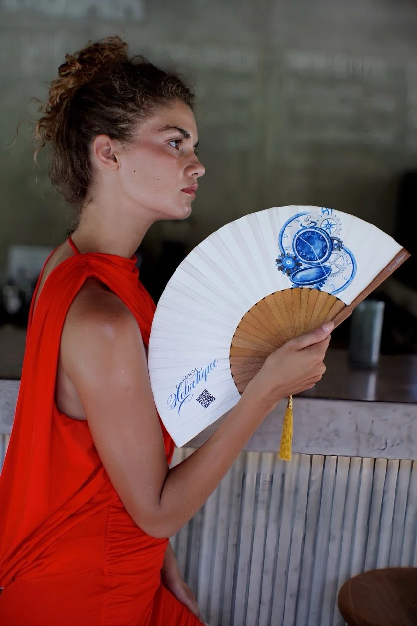 Elegant white and blue bespoke hand fan with natural wooden ribs, designed for premium hospitality and event gifting.