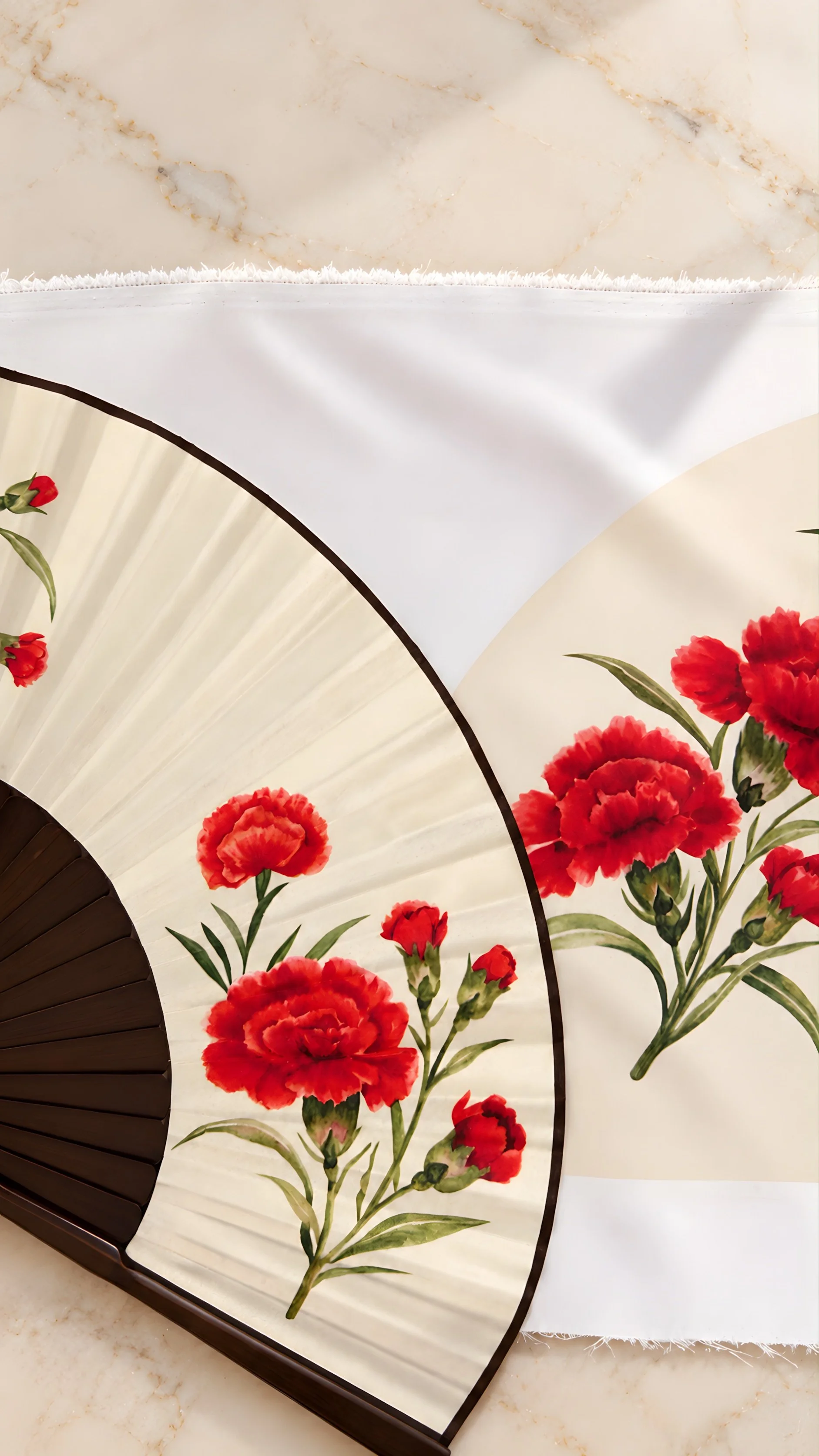 Close-up of a hand-painted acrylic edge on a custom hand fan. Each line is applied by hand to add depth, contrast and a more exclusive finish to the piece.