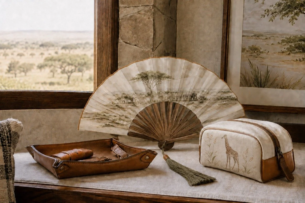 Coordinated bespoke safari hotel collection with a handcrafted hand fan, giraffe travel pouch and leather valet tray by Island Whisper Atelier.